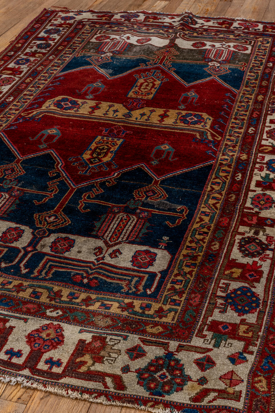 4' x 7' one-of-a-kind handmade antique Malayer rug. Color palette: crimson, navy, ivory, burgundy, camel, cobalt, taupe, red