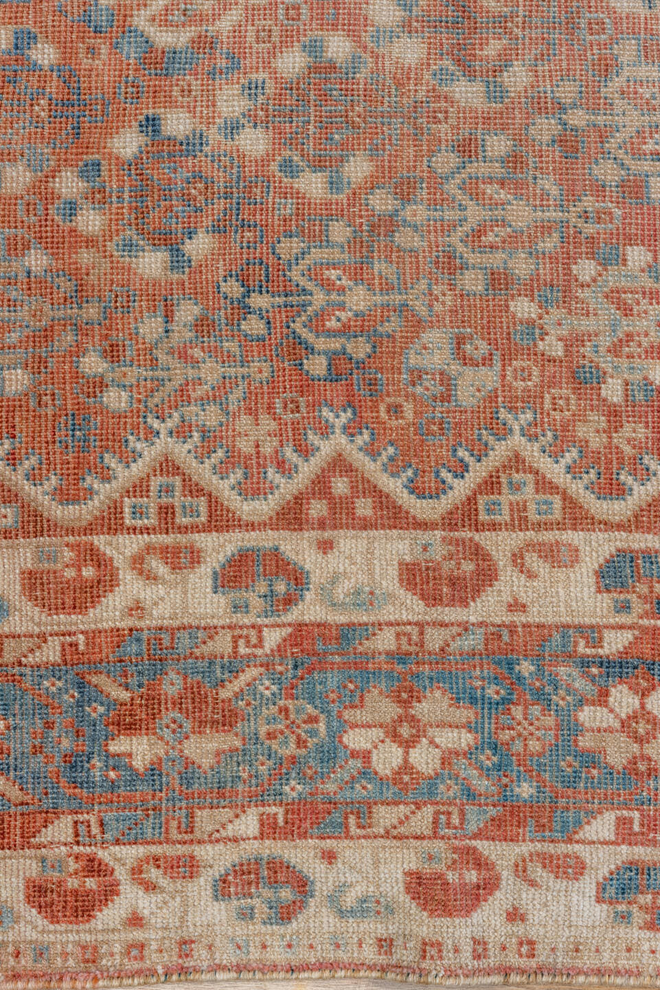 7' x 9' one-of-a-kind handmade vintage Shiraz rug. Color palette: terra cotta, ivory, sky blue, rust, beige, slate