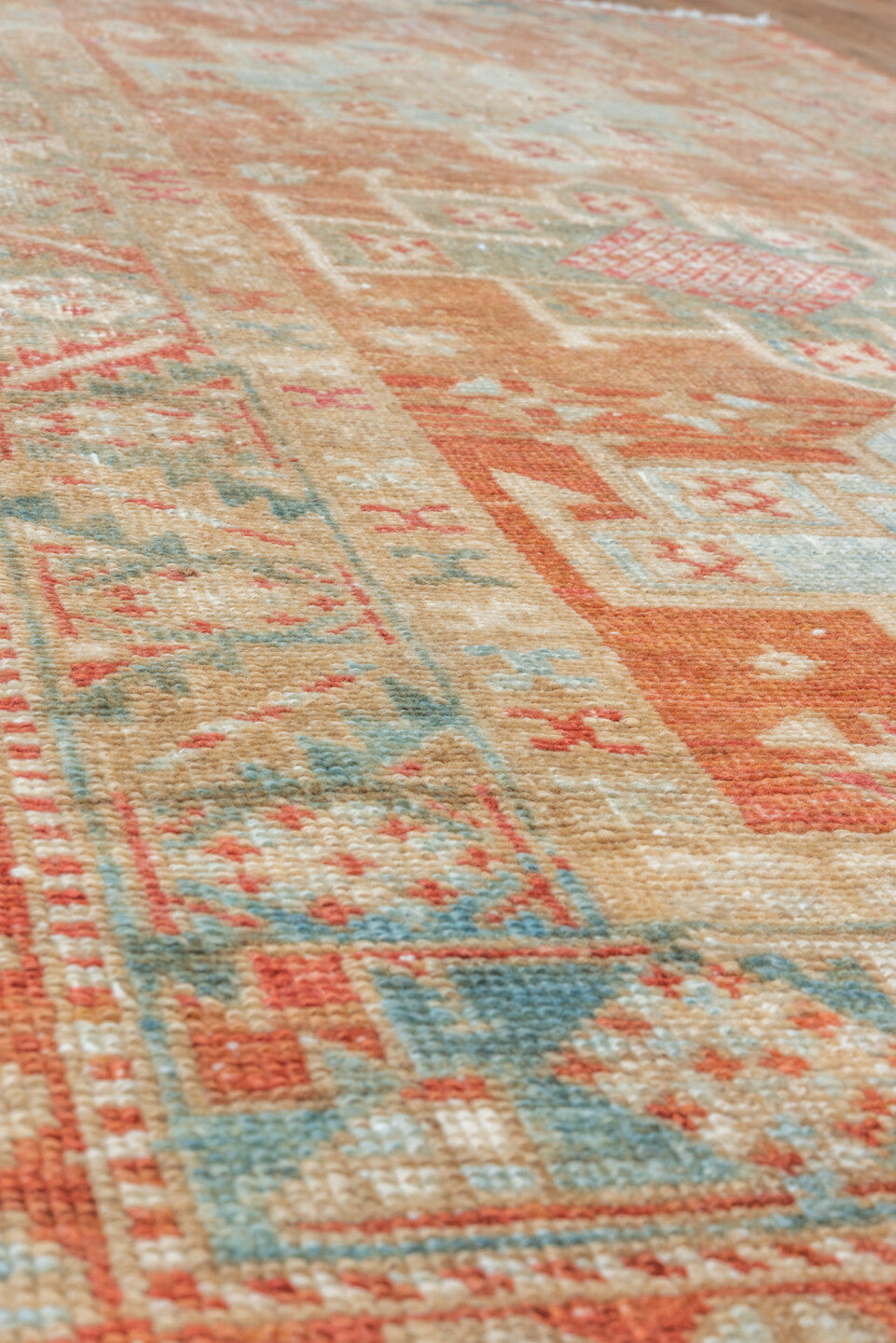 3' x 5' one-of-a-kind handmade vintage Heriz small size rug. Color palette: terra cotta, ivory, pale blue, rust, camel, sage