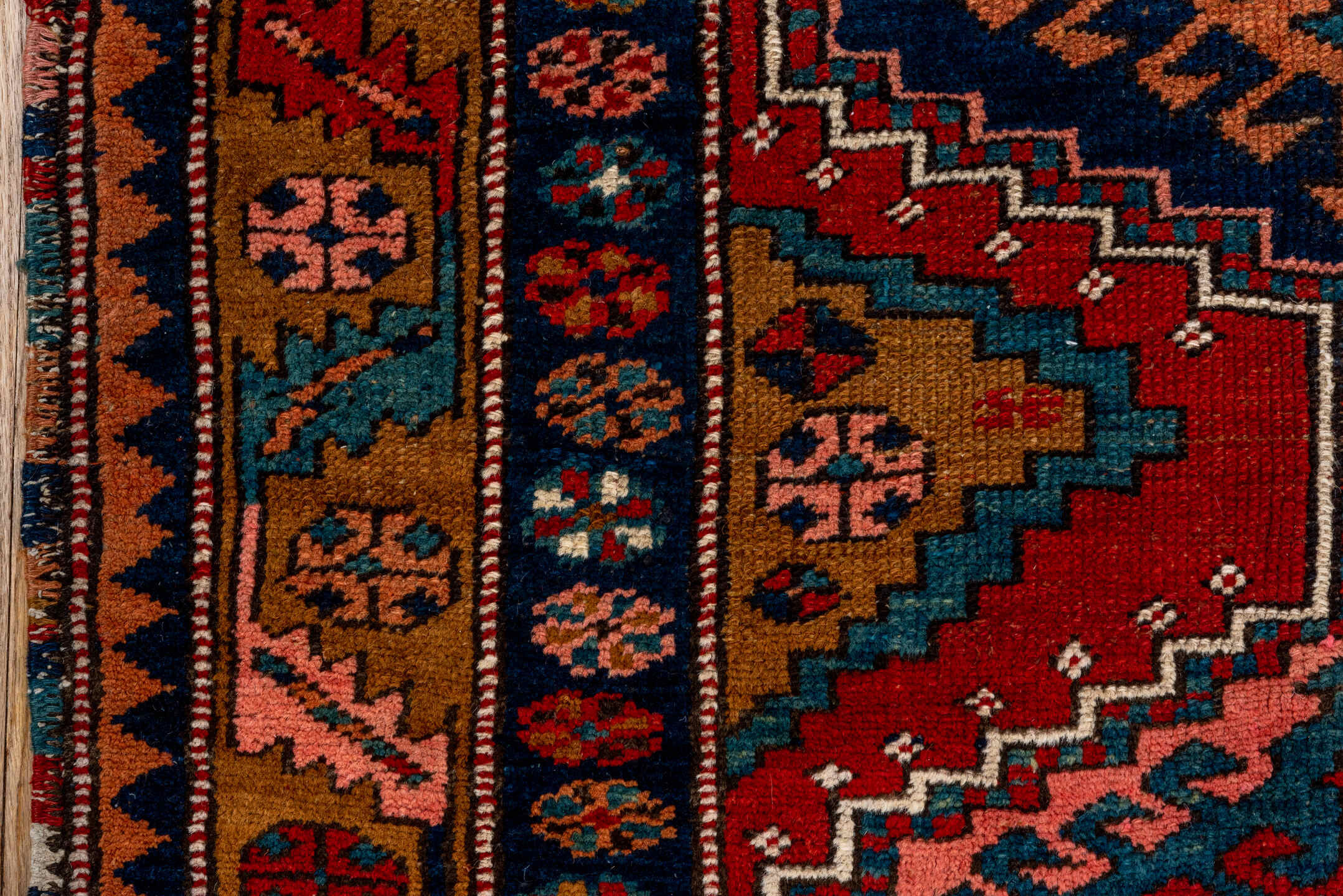 3' x 12' one-of-a-kind handmade vintage Heriz runner rug. Color palette: rust, navy, terra cotta, camel, ivory, teal, rose