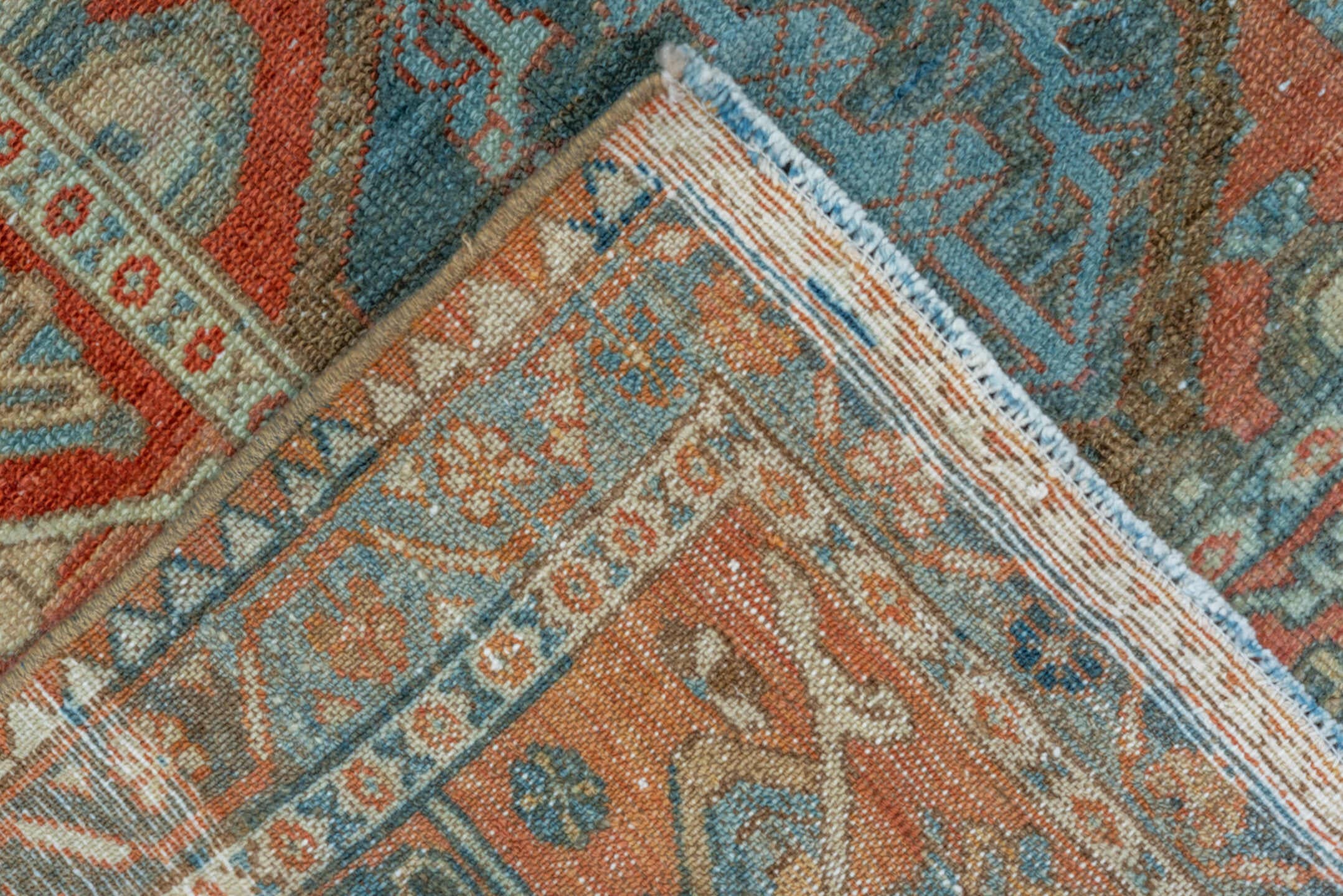 5' x 10' one-of-a-kind handmade vintage Baktiary runner rug. Color palette: rust, sky blue, ivory, camel, teal, terra cotta