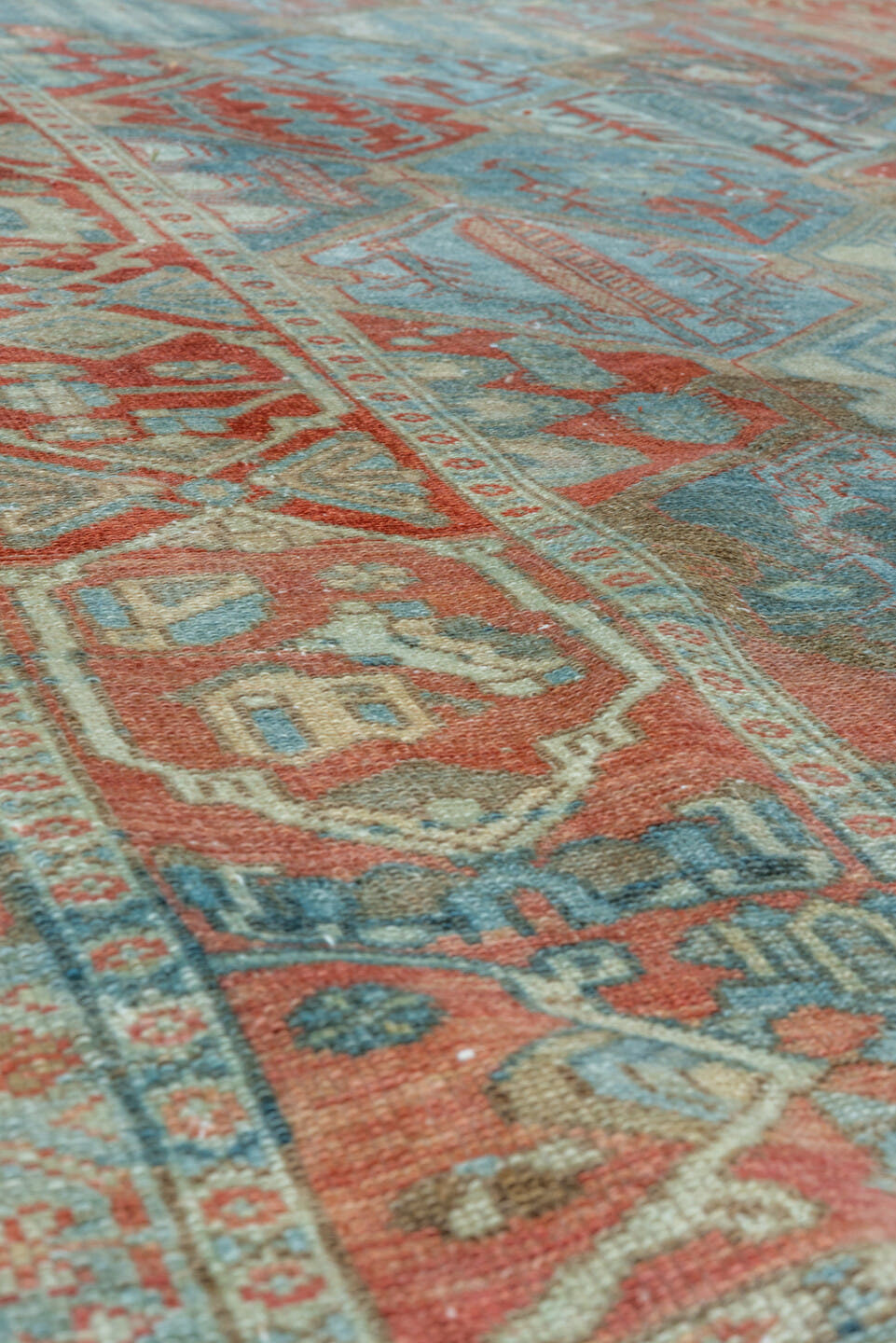 5' x 10' one-of-a-kind handmade vintage Baktiary runner rug. Color palette: rust, sky blue, ivory, camel, teal, terra cotta