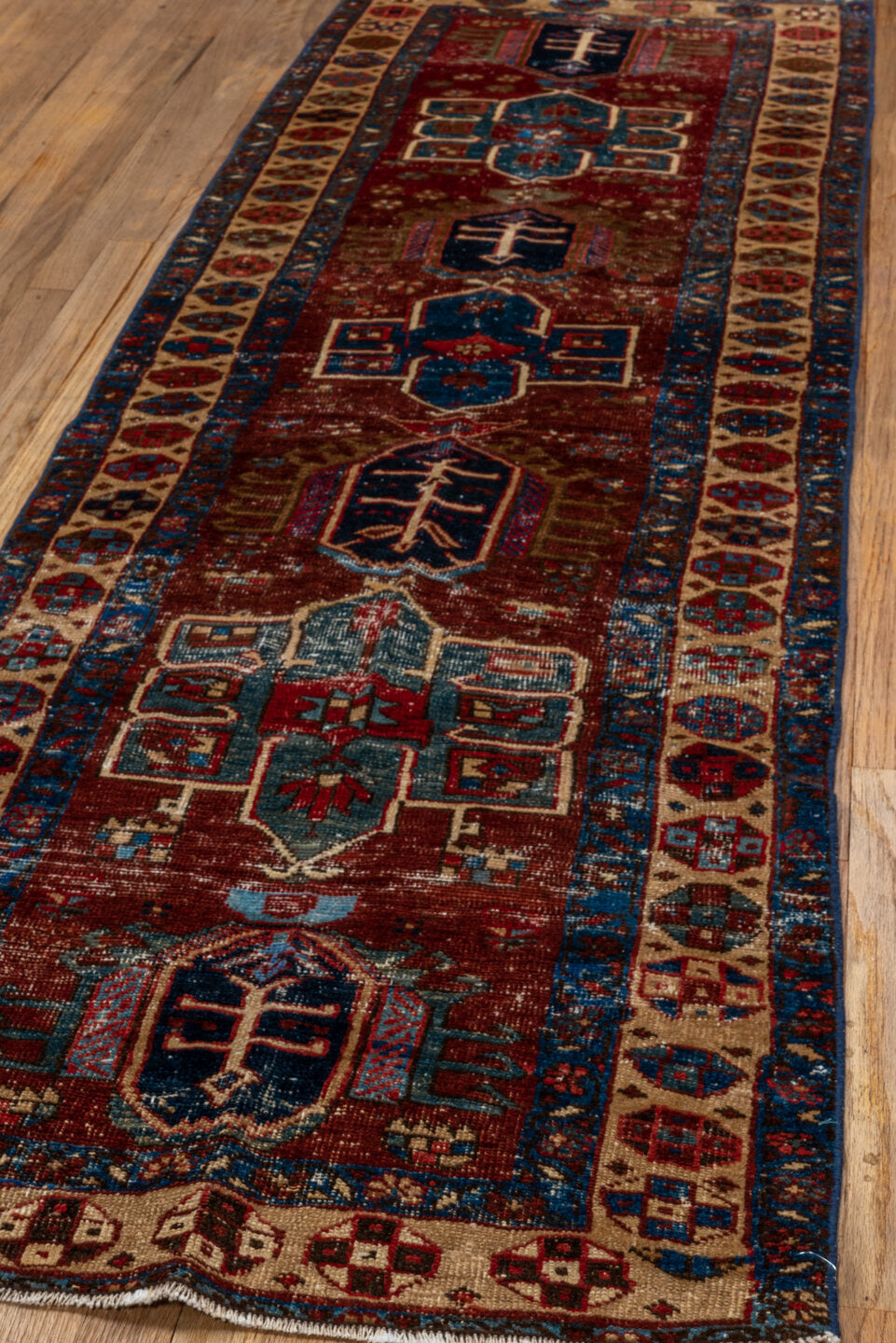 2' x 8' one-of-a-kind handmade vintage Heriz runner rug. Color palette: rust, ivory, navy, indigo, camel, taupe, burgundy