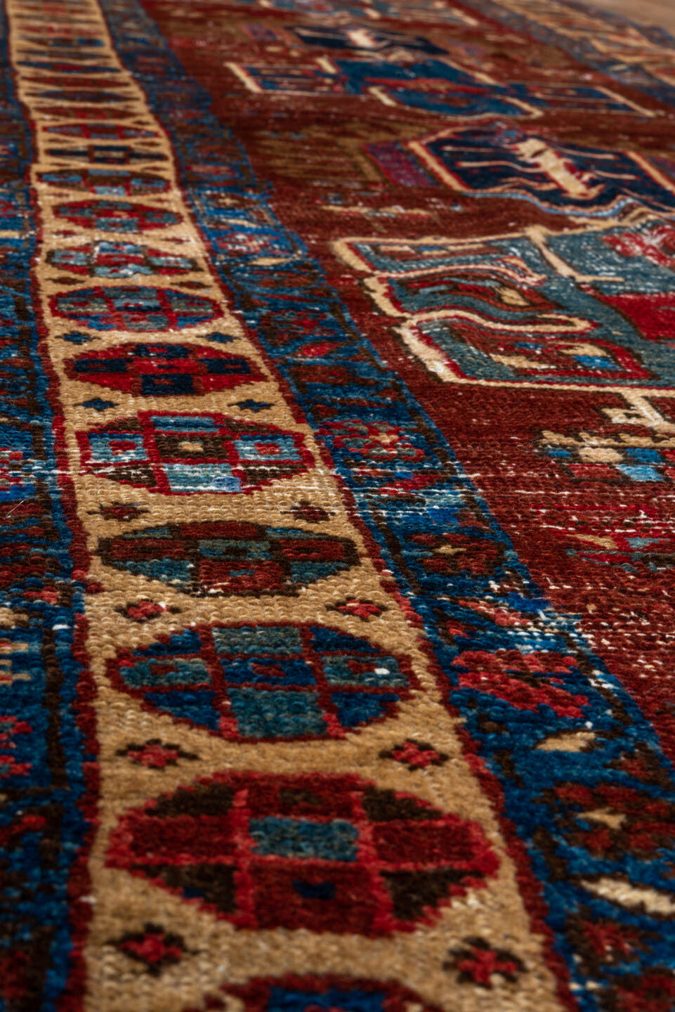 2' x 8' one-of-a-kind handmade vintage Heriz runner rug. Color palette: rust, ivory, navy, indigo, camel, taupe, burgundy