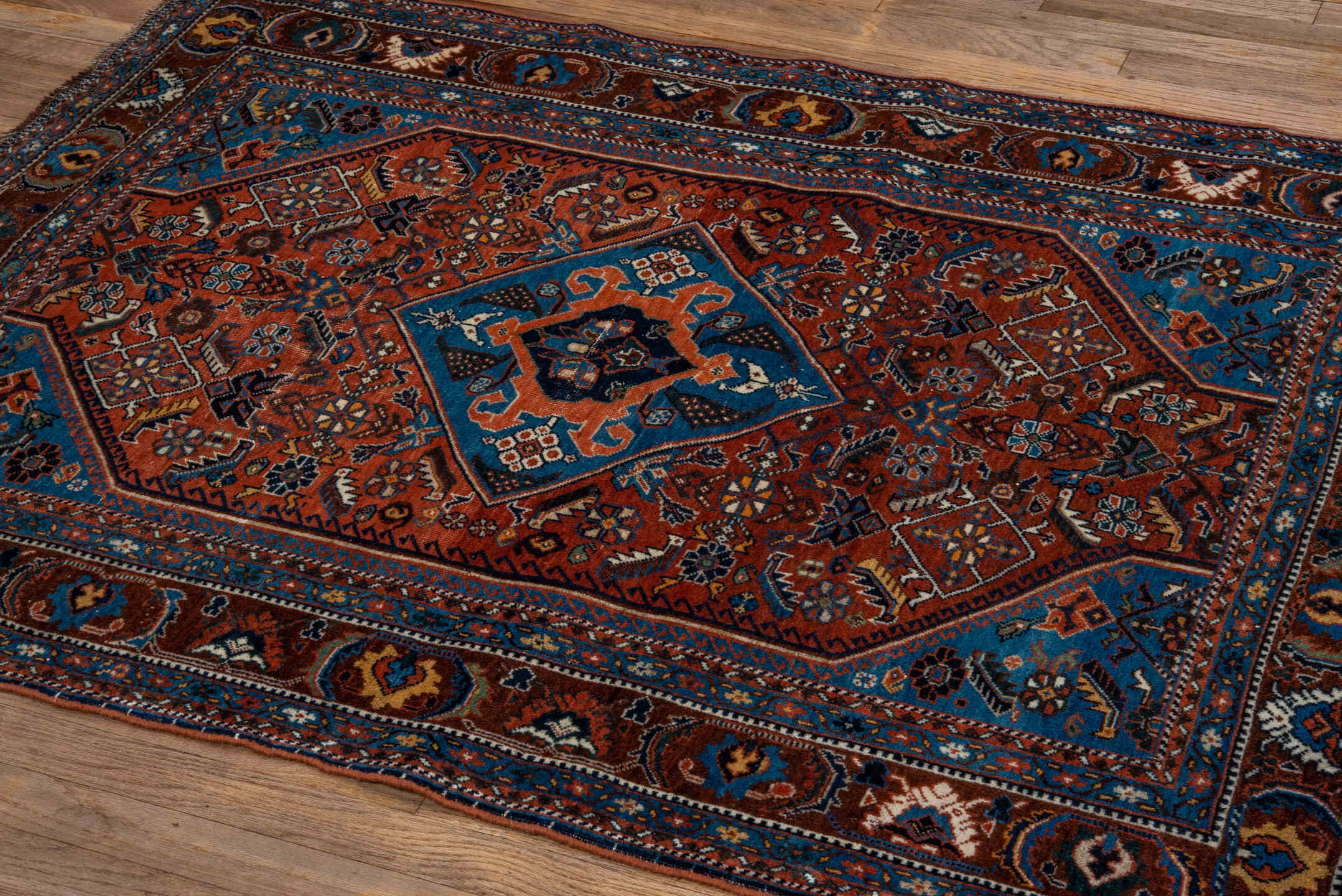 3' x 5' one-of-a-kind handmade vintage Shiraz small size rug. Color palette: rust, turquoise, navy, ivory, camel, brown