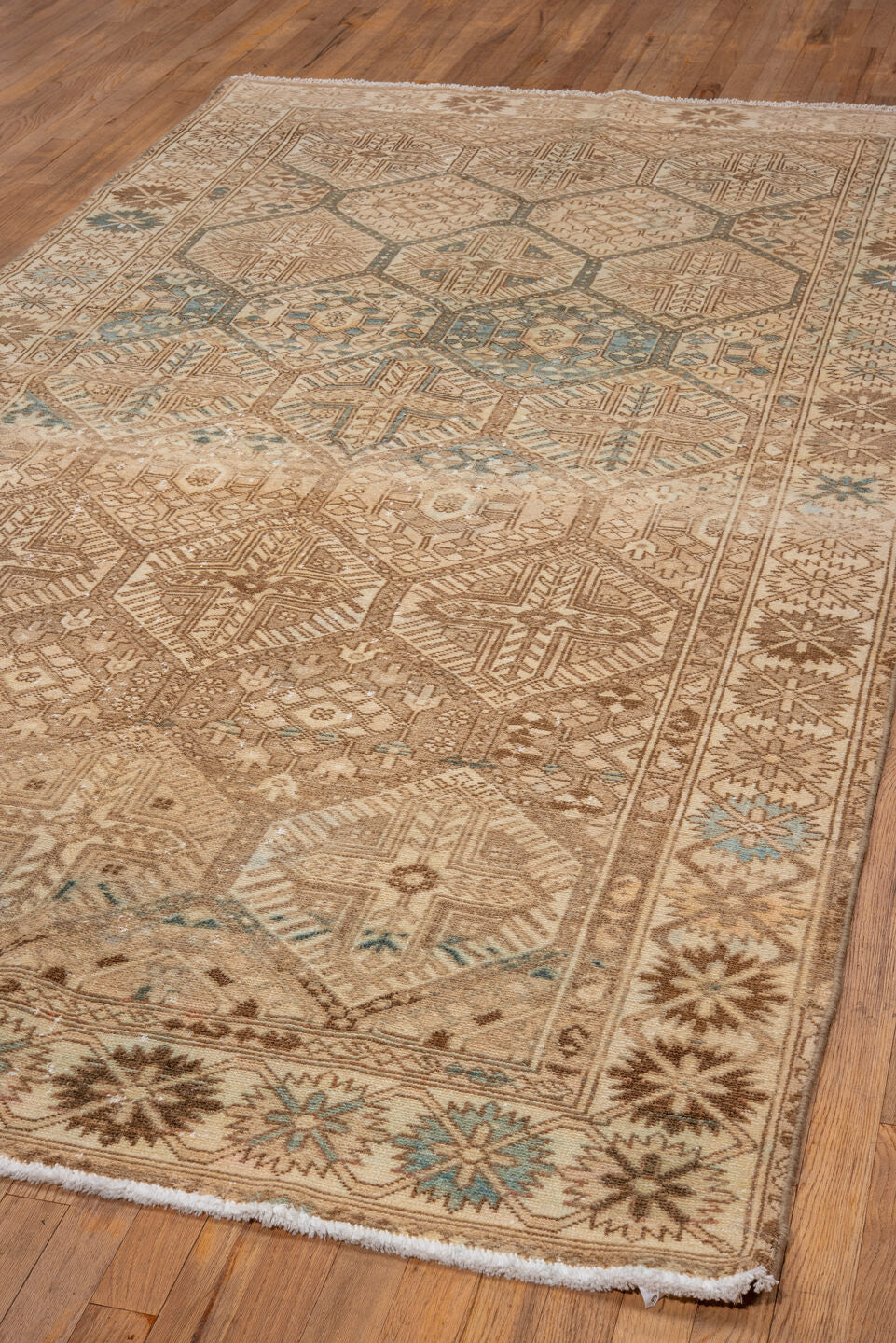 5' x 10' one-of-a-kind handmade vintage Baktiary medium size rug. Color palette: camel, ivory, taupe, brown, sky_blue, beige