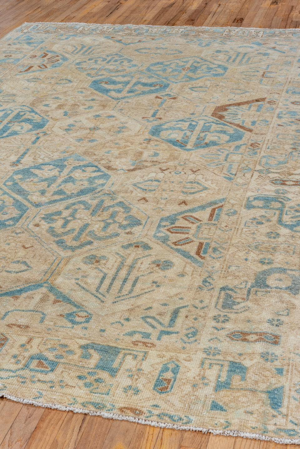 7' x 10' one-of-a-kind handmade vintage Baktiary large size rug. Color palette: brown, gray, light gray, off-white, pink