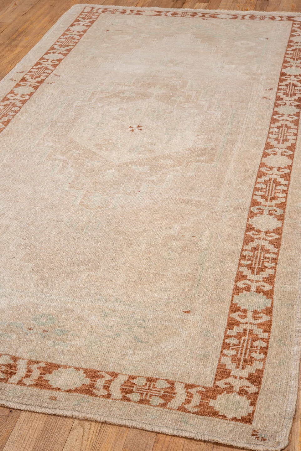 4' x 8' one-of-a-kind handmade vintage Oushak rug. Color palette: ivory, beige, rust, cream, pale aqua, taupe, terracotta