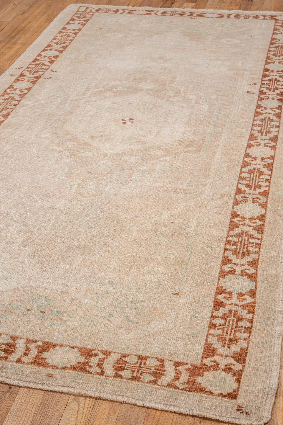 4' x 8' one-of-a-kind handmade vintage Oushak rug. Color palette: ivory, beige, rust, cream, pale aqua, taupe, terracotta
