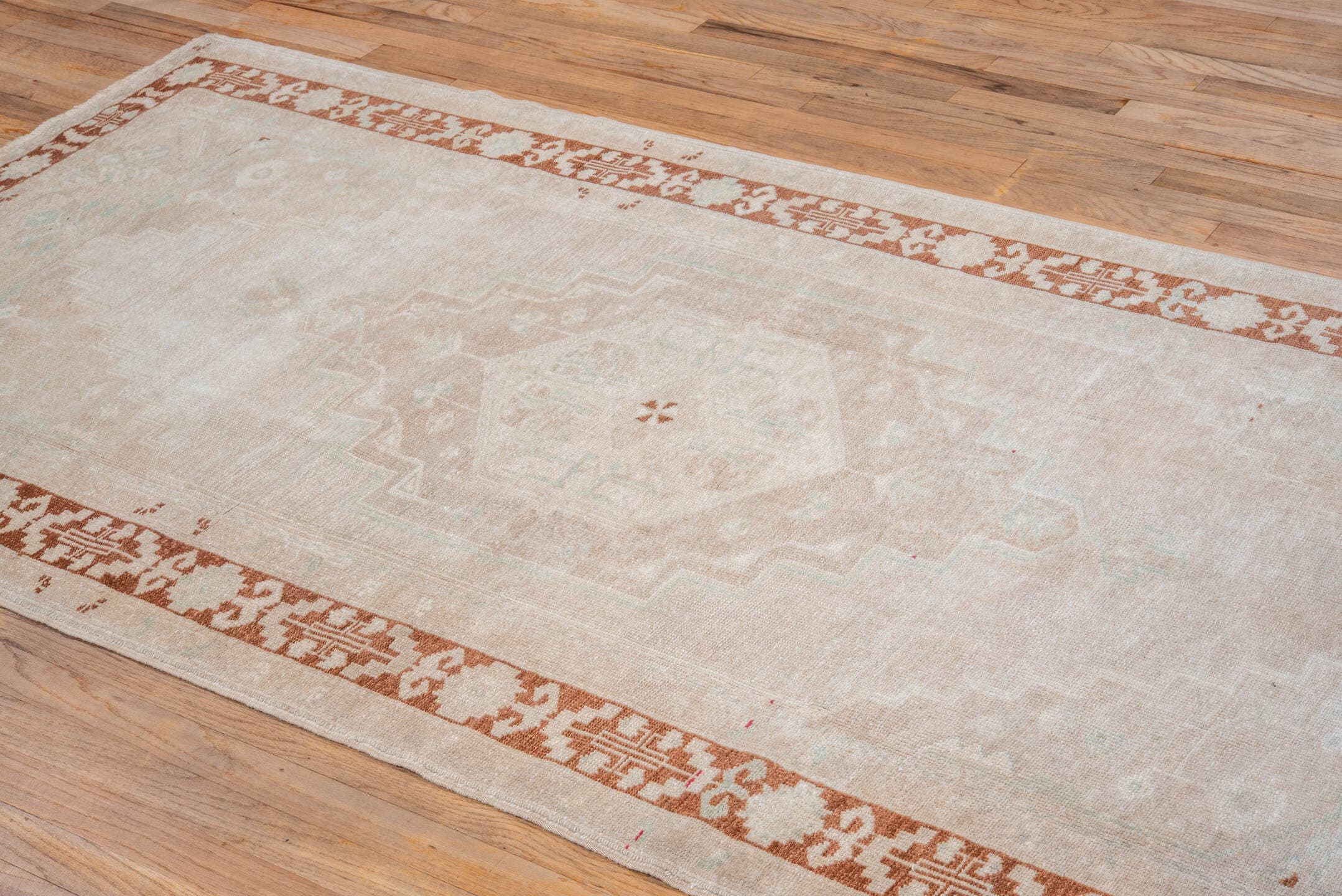 4' x 8' one-of-a-kind handmade vintage Oushak rug. Color palette: ivory, beige, rust, cream, pale aqua, taupe, terracotta
