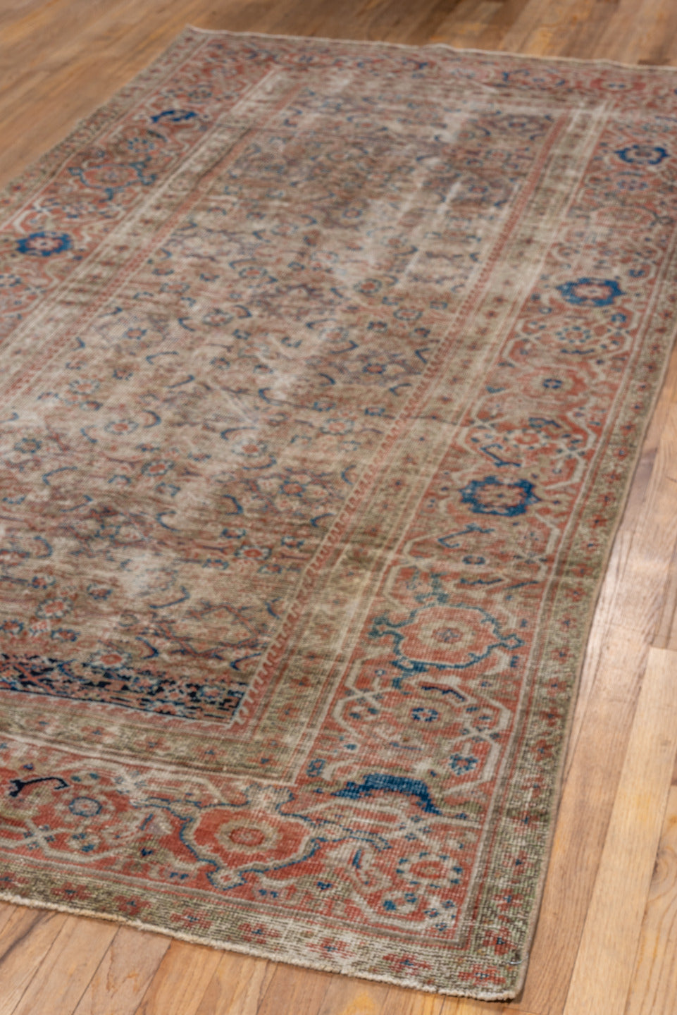 4' x 9' one-of-a-kind handmade vintage Mahal runner rug. Color palette: brown, gray, light gray, off-white, pink, silver