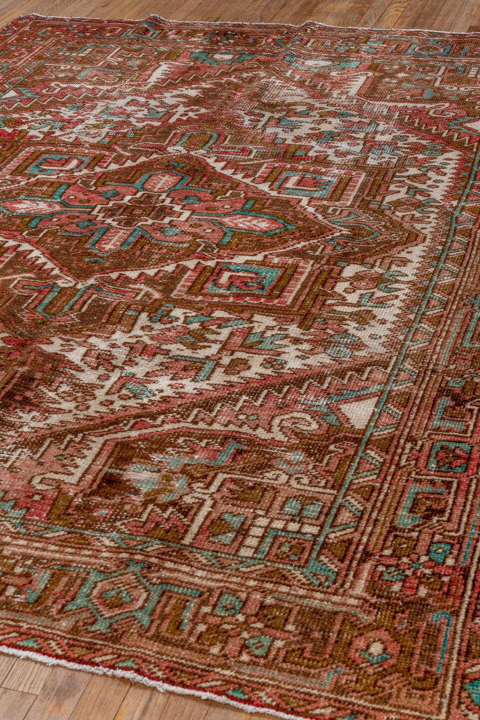 6' x 8' one-of-a-kind handmade vintage Heriz medium size rug. Color palette: blue, brown, gray, green, off-white, pink, red