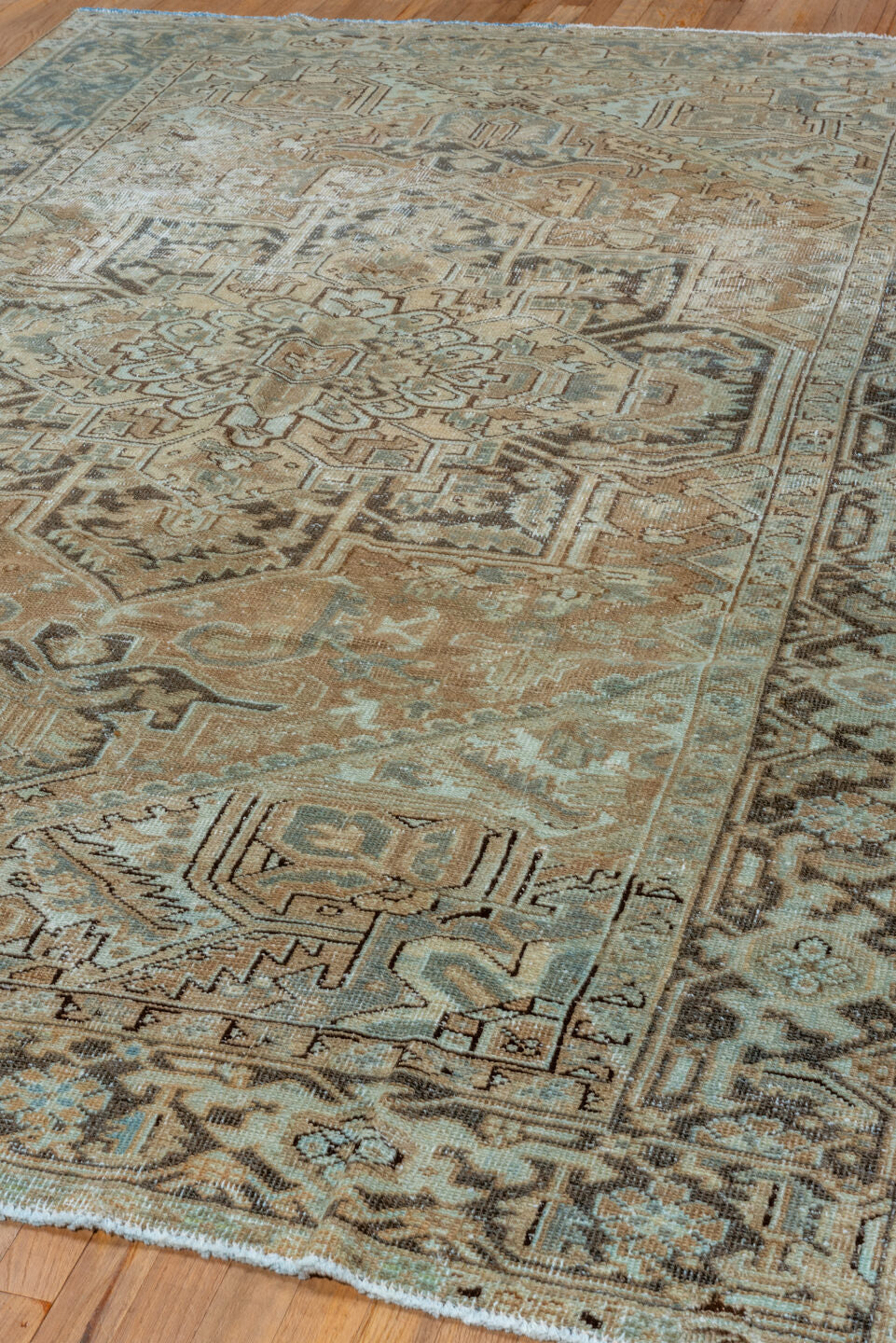 6' x 9' one-of-a-kind handmade vintage Heriz medium size rug. Color palette: camel, ivory, pale blue, taupe, charcoal, beige