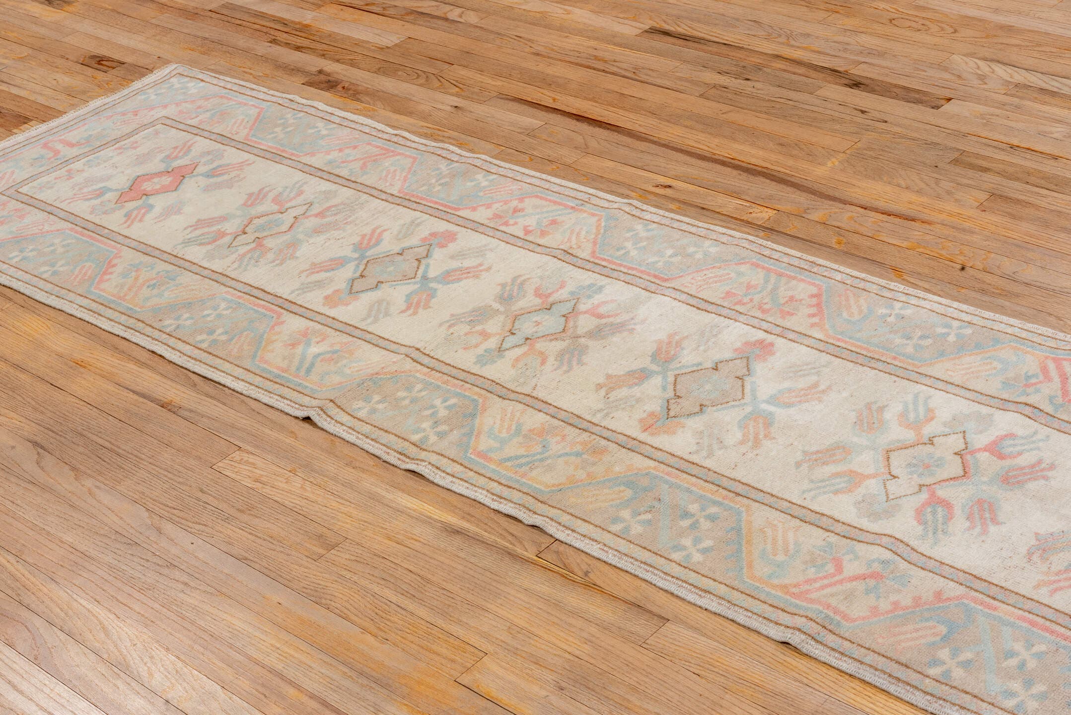 2' x 9' one-of-a-kind handmade vintage Oushak runner rug. Color palette: ivory, pale blue, blush, taupe, cream, peach