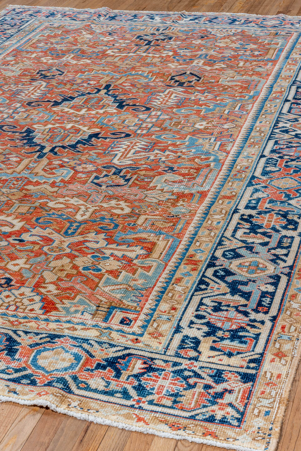 7' x 10' one-of-a-kind handmade vintage Heriz large size rug. Color palette: terra cotta, navy, ivory, sky blue, camel, rust