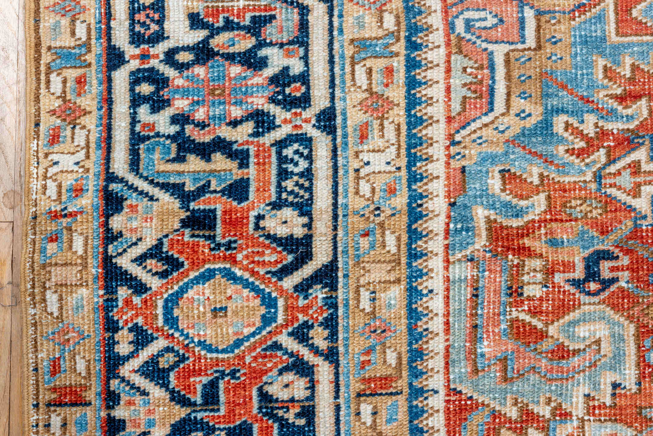 7' x 10' one-of-a-kind handmade vintage Heriz large size rug. Color palette: terra cotta, navy, ivory, sky blue, camel, rust