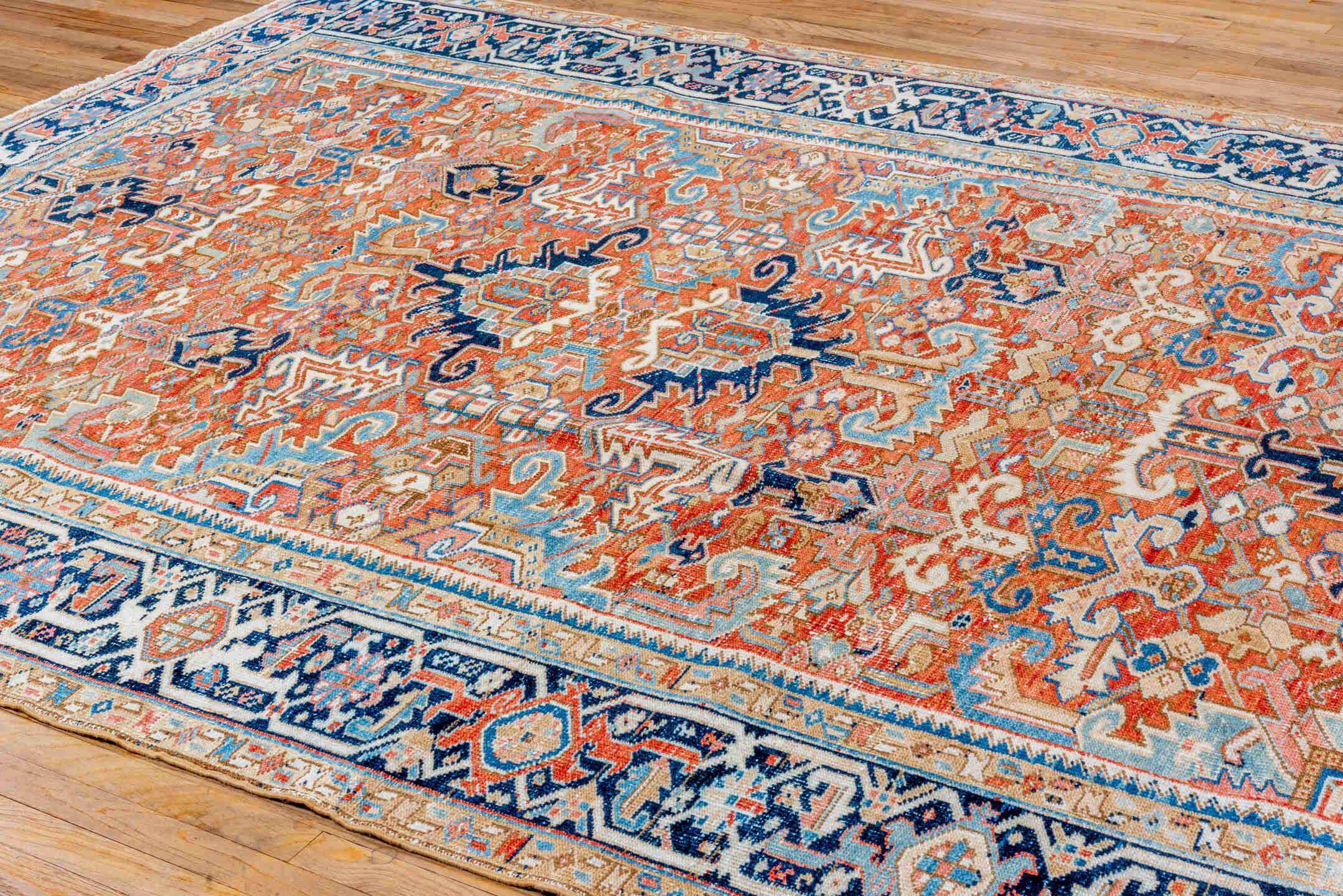 7' x 10' one-of-a-kind handmade vintage Heriz large size rug. Color palette: terra cotta, navy, ivory, sky blue, camel, rust