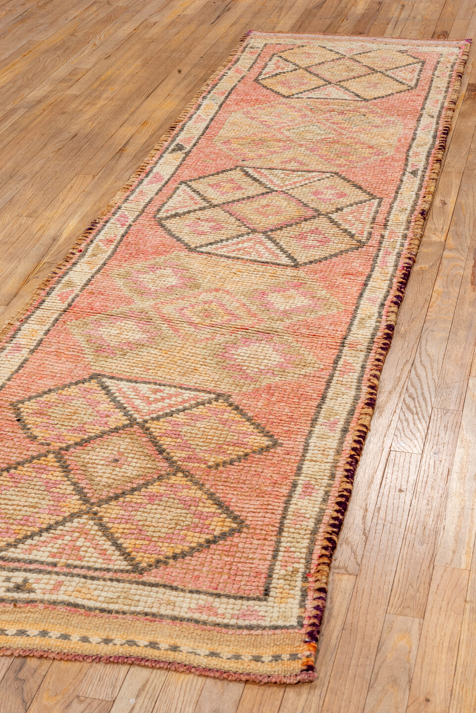2' x 10' one-of-a-kind handmade vintage Oushak runner rug. Color palette: brown, dark salmon, off-white, orange, pink, red