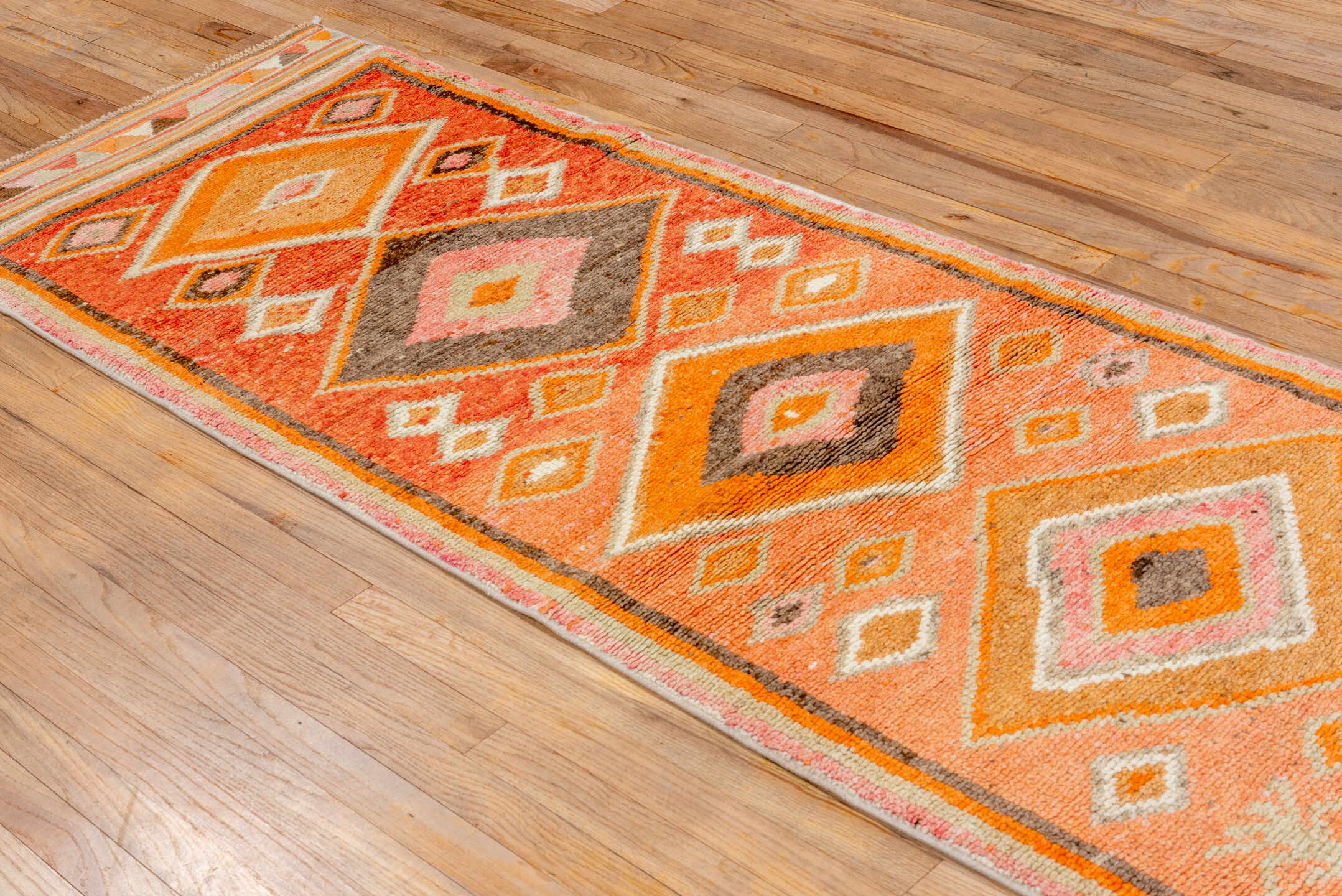2' x 10' one-of-a-kind handmade vintage Oushak runner rug. Color palette: brown, light gray, off-white, orange, pink, red
