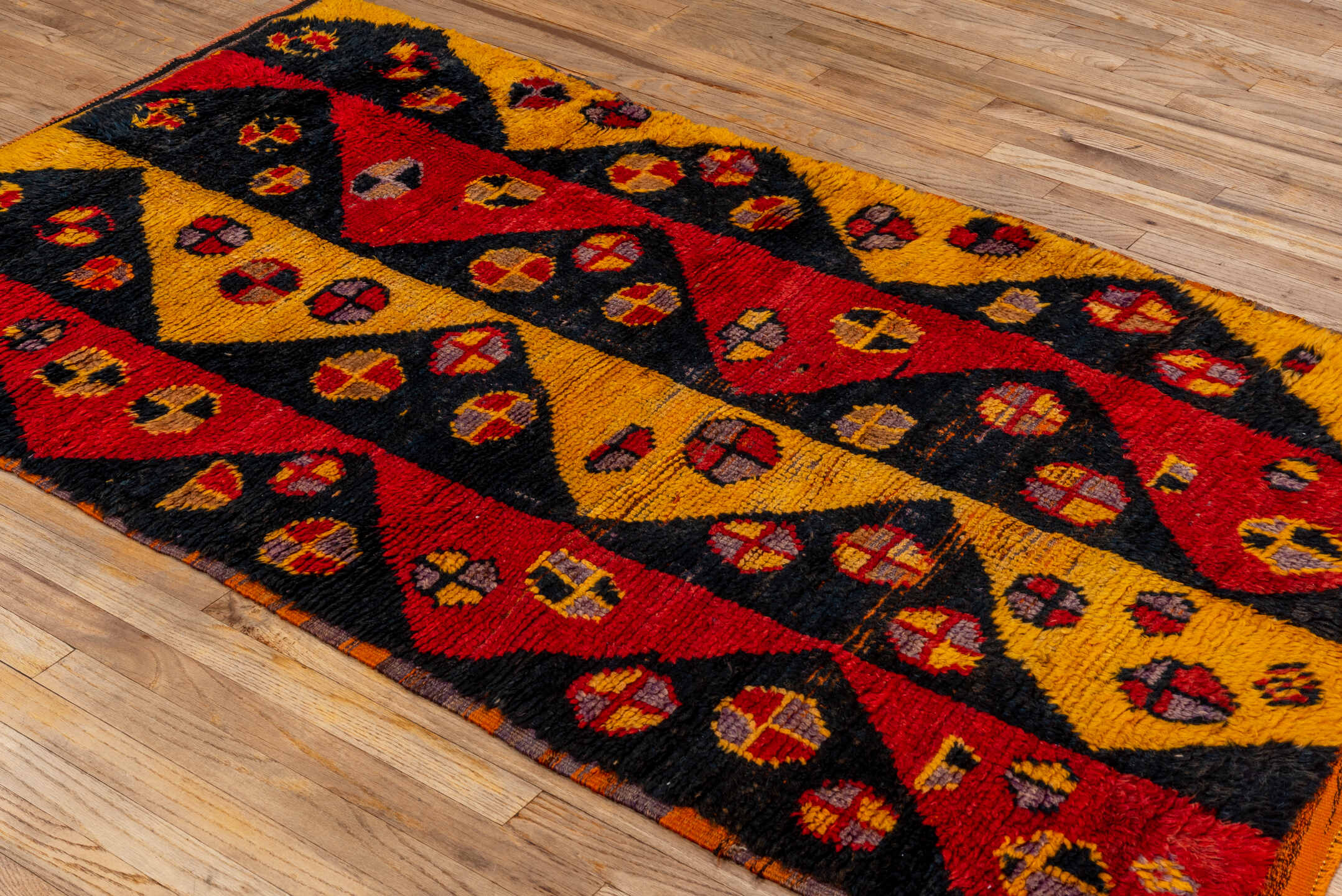 3' x 6' one-of-a-kind handmade vintage Tulu small size rug. Color palette: gold, black, crimson, rust, taupe, plum, red