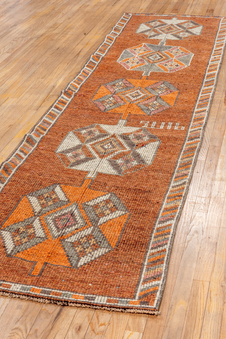 2' x 11' one-of-a-kind handmade vintage Oushak runner rug. Color palette: rust, orange, ivory, gray, charcoal, taupe