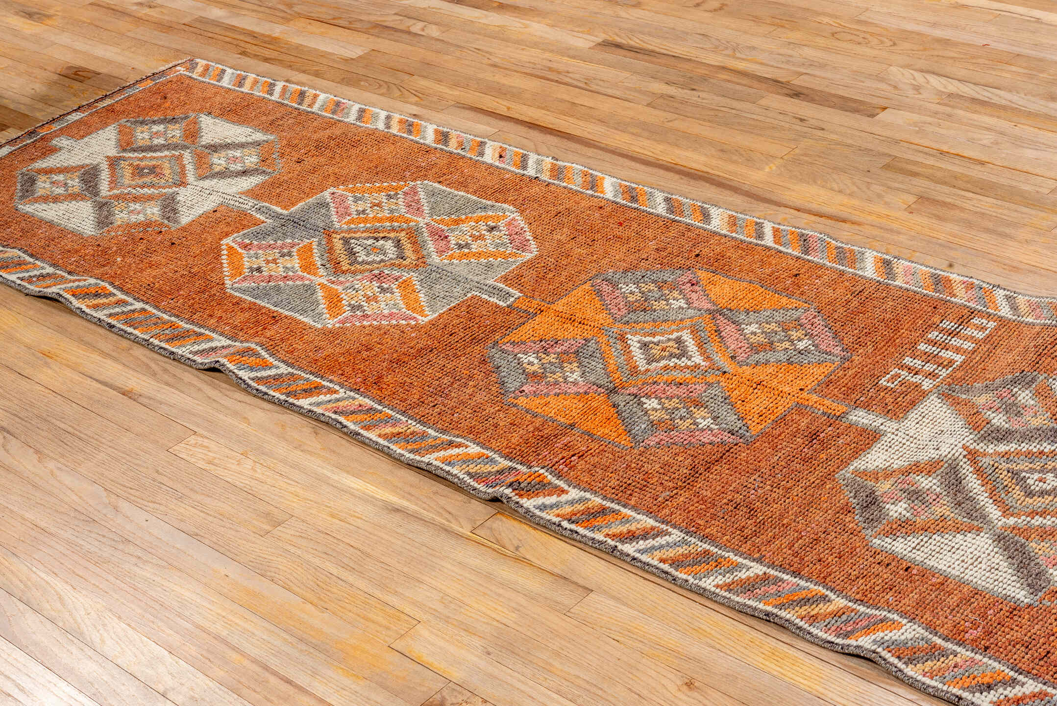 2' x 11' one-of-a-kind handmade vintage Oushak runner rug. Color palette: rust, orange, ivory, gray, charcoal, taupe