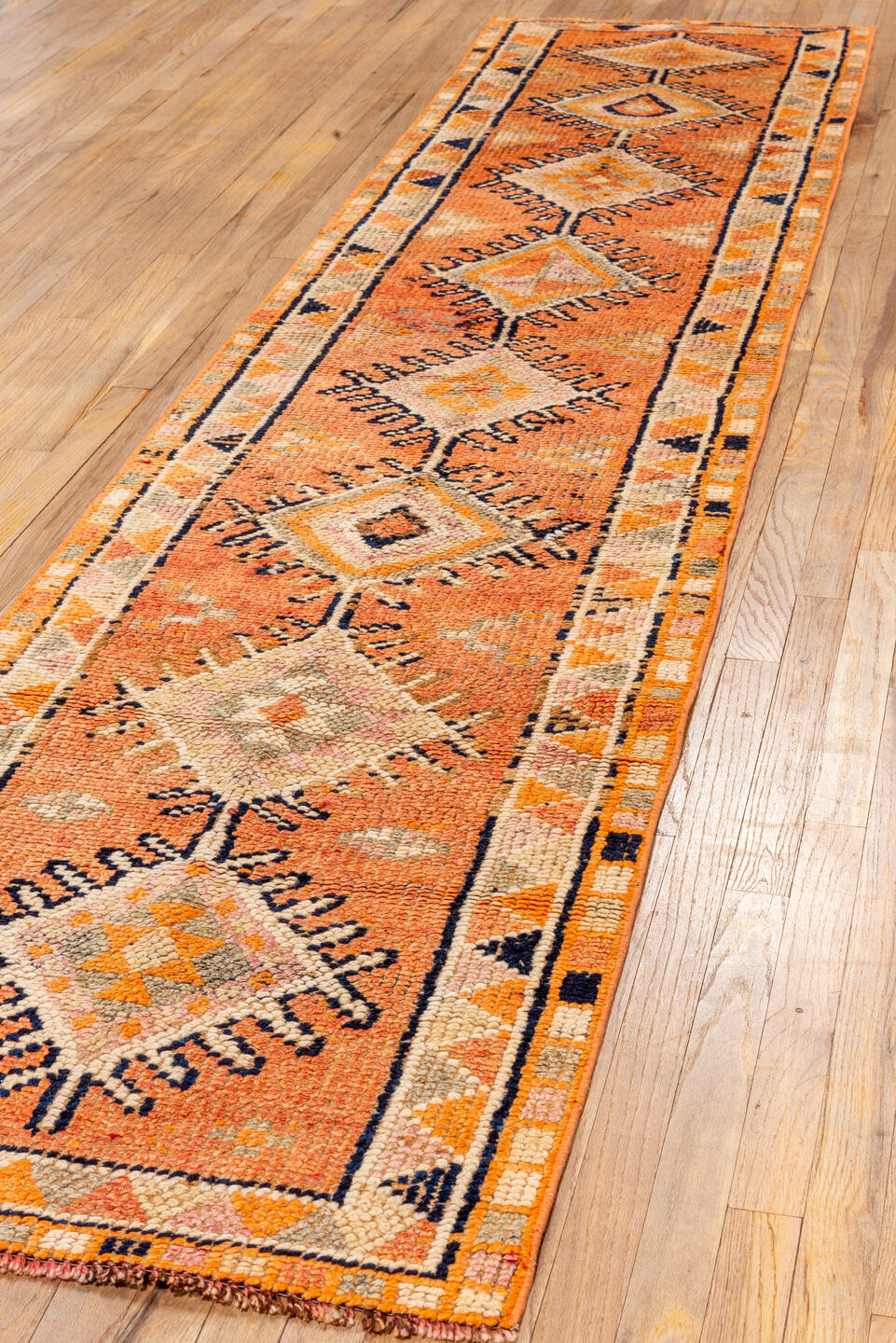 2' x 11' one-of-a-kind handmade vintage Oushak runner rug. Color palette: coral, ivory, orange, navy, taupe, camel, charcoal