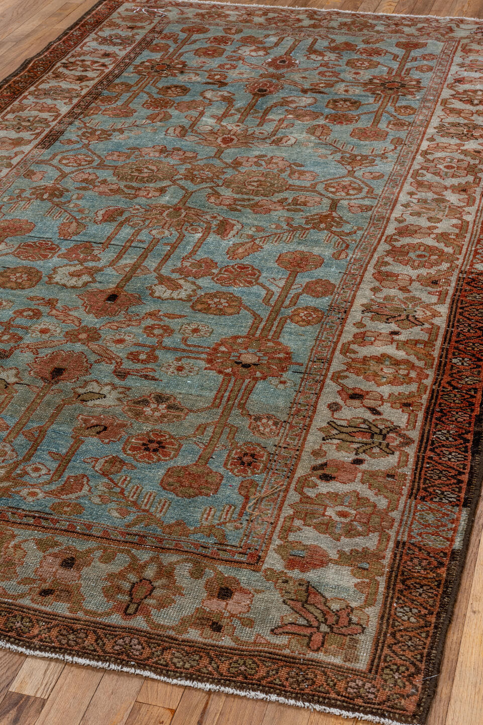 5' x 9' one-of-a-kind handmade vintage Lilian medium size rug. Color palette: light blue, ivory, rust, camel, taupe, brown
