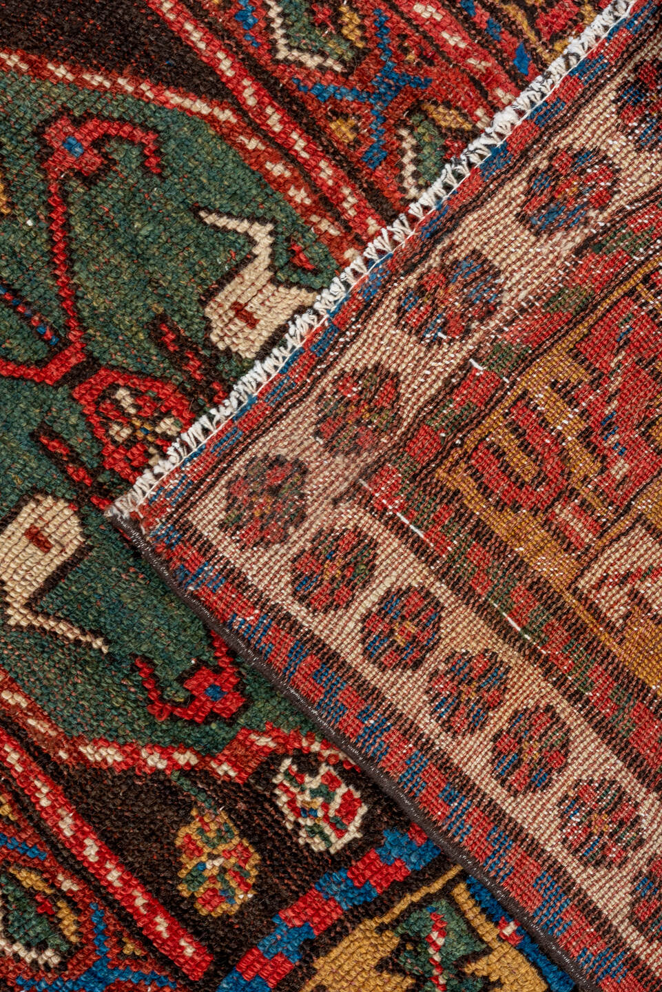 3' x 12' one-of-a-kind handmade vintage Kurd runner rug. Color palette: black, blue, brown, gray, off-white, orange, red
