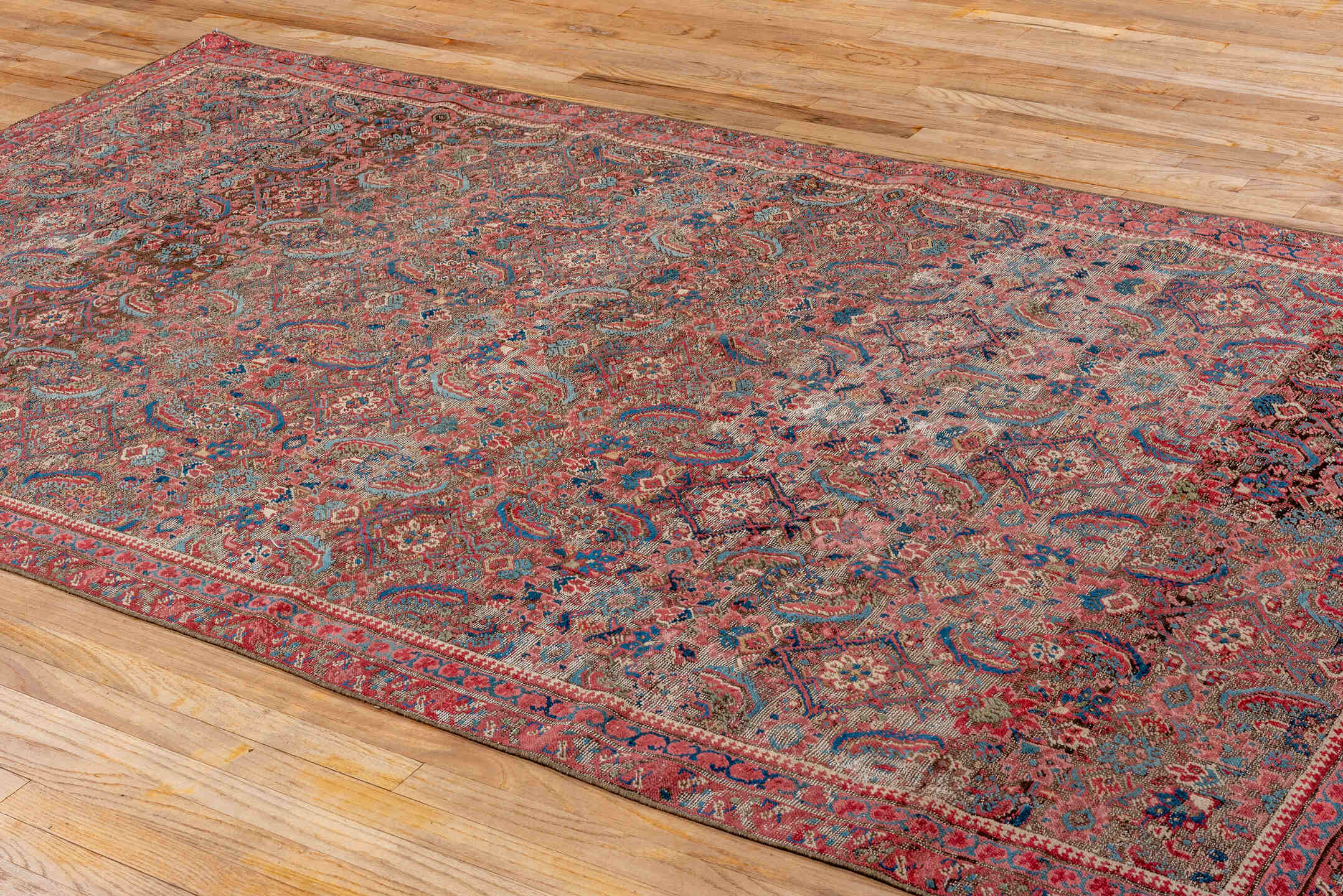 5' x 9' one-of-a-kind handmade vintage Bakhshayesh medium size rug. Color palette: blue, brown, gray, off-white, orange