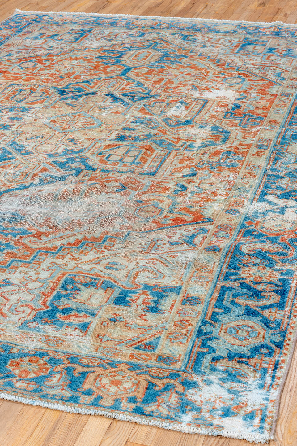 7' x 10' one-of-a-kind handmade vintage Heriz large size rug. Color palette: ivory, sky blue, rust, camel, terracotta