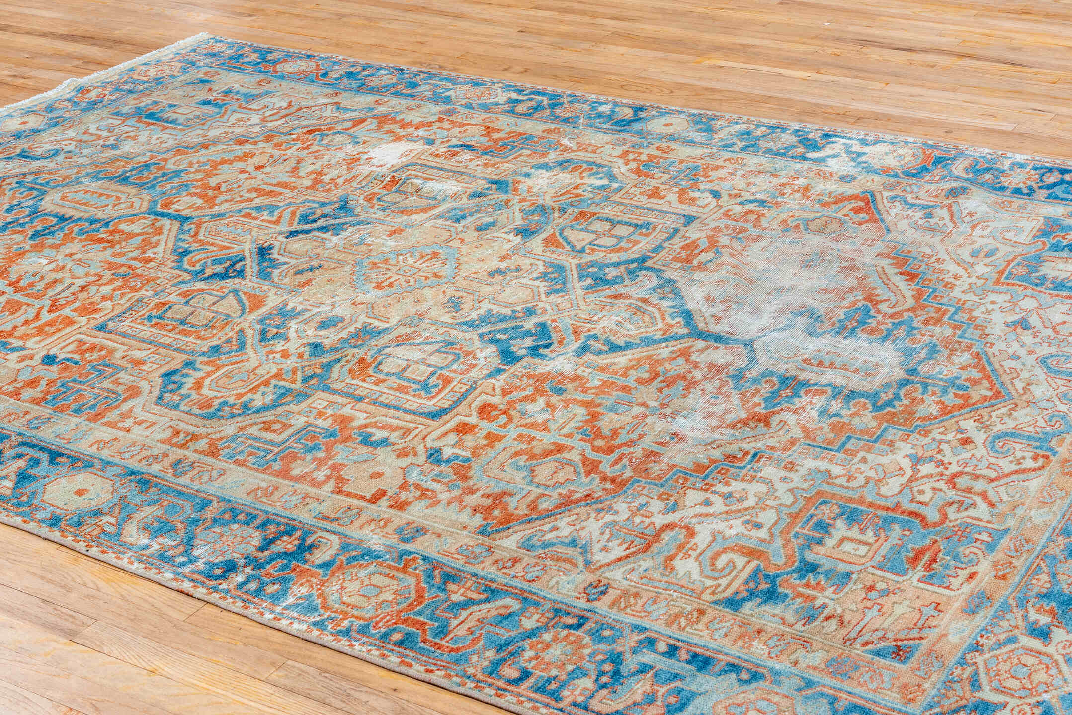 7' x 10' one-of-a-kind handmade vintage Heriz large size rug. Color palette: ivory, sky blue, rust, camel, terracotta