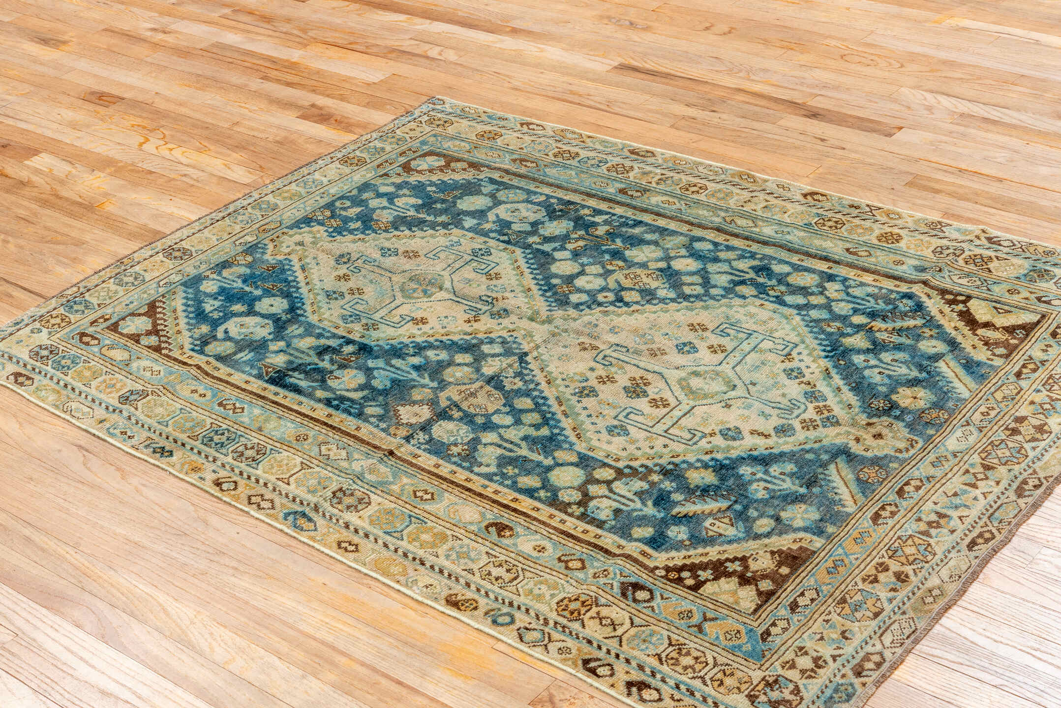 4' x 5' one-of-a-kind handmade vintage Shiraz small size rug. Color palette: blue, ivory, camel, brown, sky blue, taupe