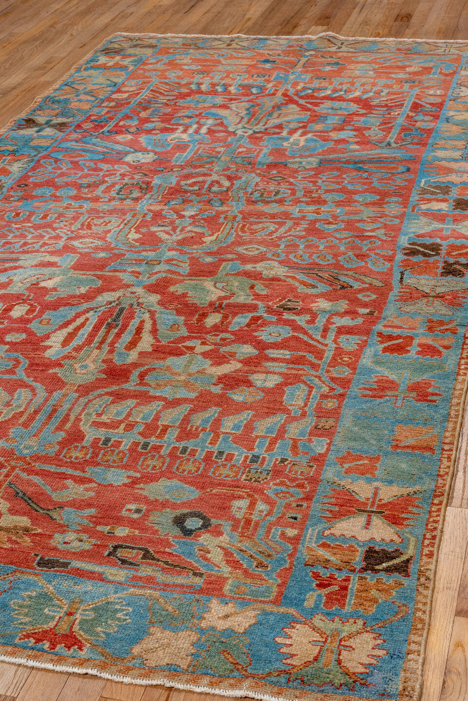 5' x 9' one-of-a-kind handmade vintage Lilian medium size rug. Color palette: coral, sky blue, ivory, taupe, rust, brown