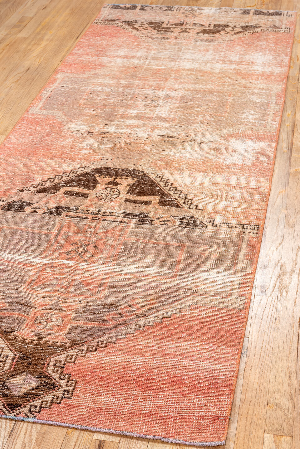 3' x 8' one-of-a-kind handmade vintage Oushak runner rug. Color palette: brown, off-white, orange, pink, red