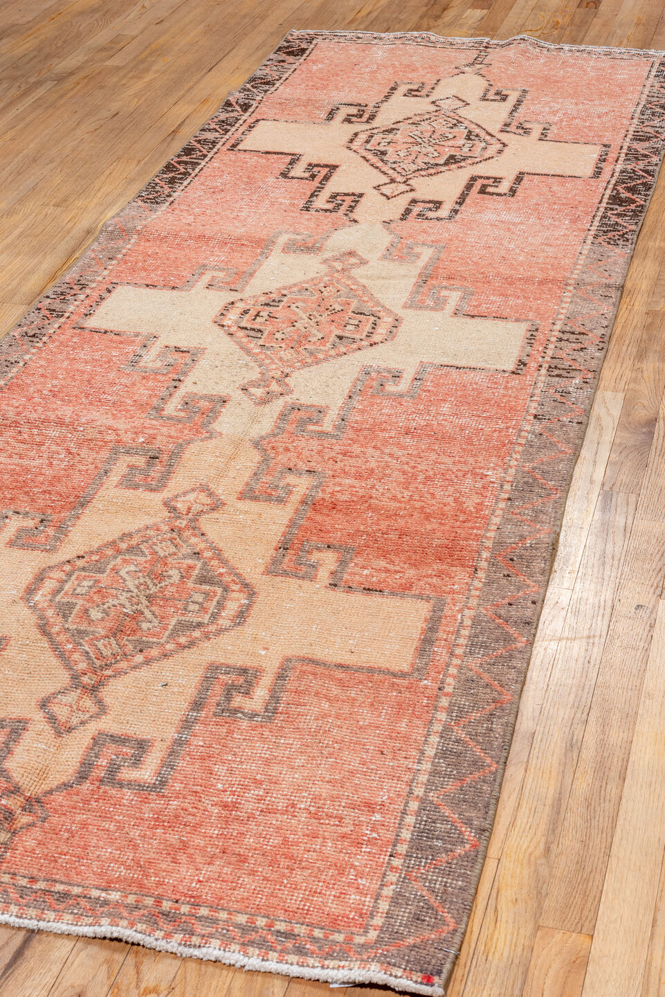 3' x 10' one-of-a-kind handmade vintage Oushak runner rug. Color palette: brown, off-white, orange, pink