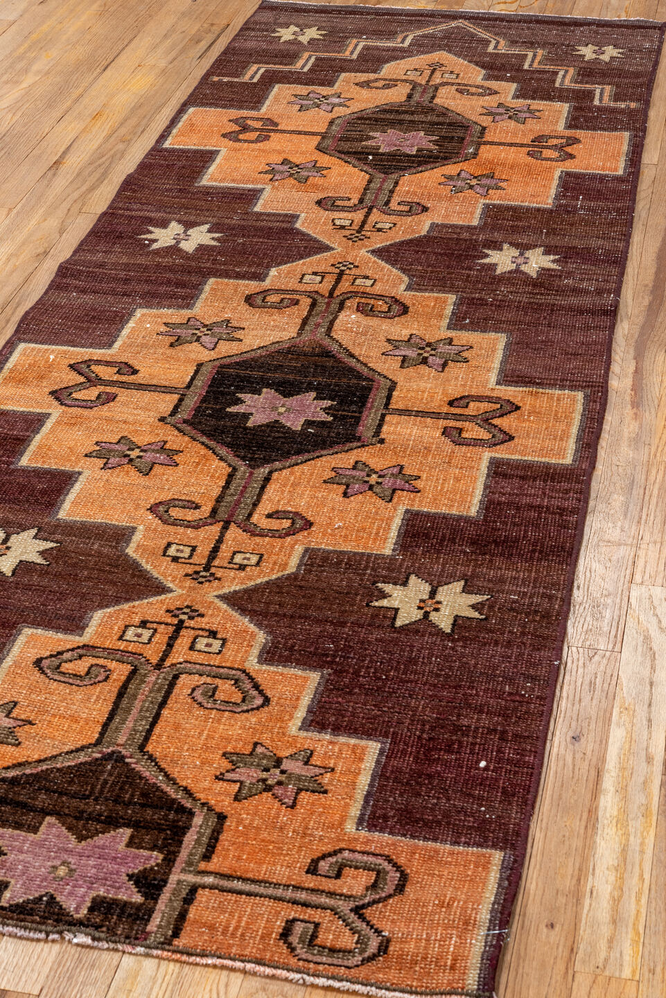 2' x 8' one-of-a-kind handmade vintage Kars runner rug. Color palette: black, brown, chocolate, orange, pink, red, redwood