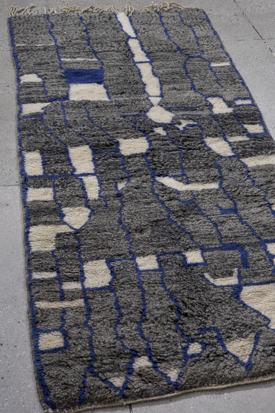 2' x 7' one-of-a-kind handmade vintage Moroccan runner rug. Color palette: gray, blue, light gray, black, off-white