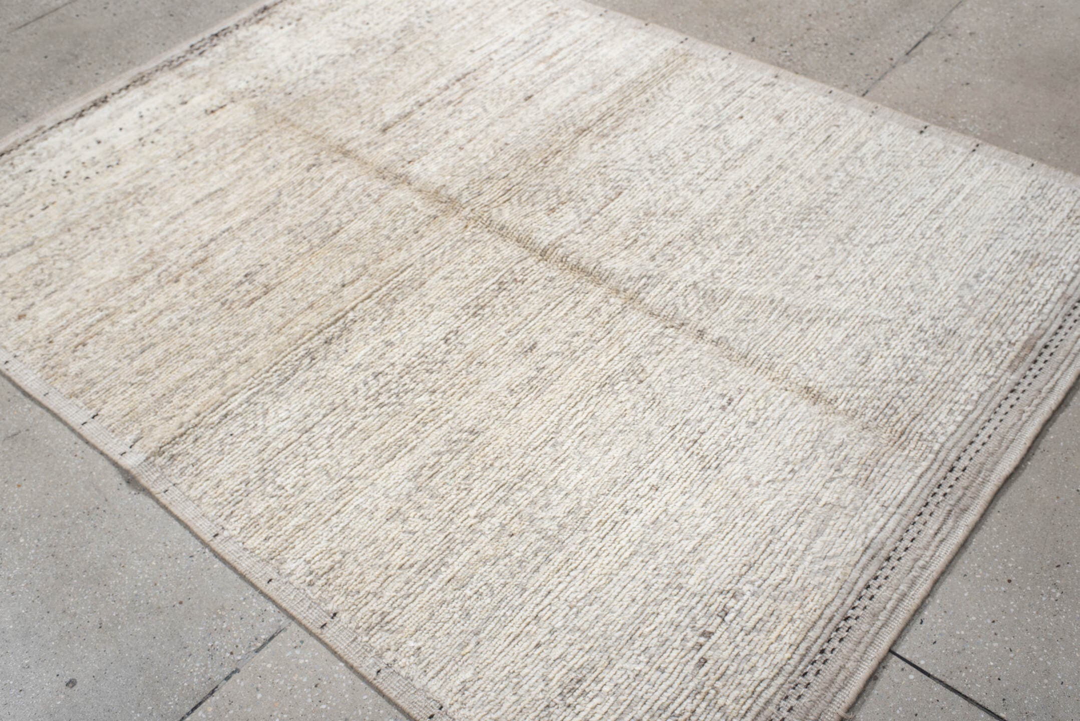 5' x 7' one-of-a-kind handmade vintage Tulu rug. Color palette: ivory, cream, taupe, charcoal, beige, gray, black