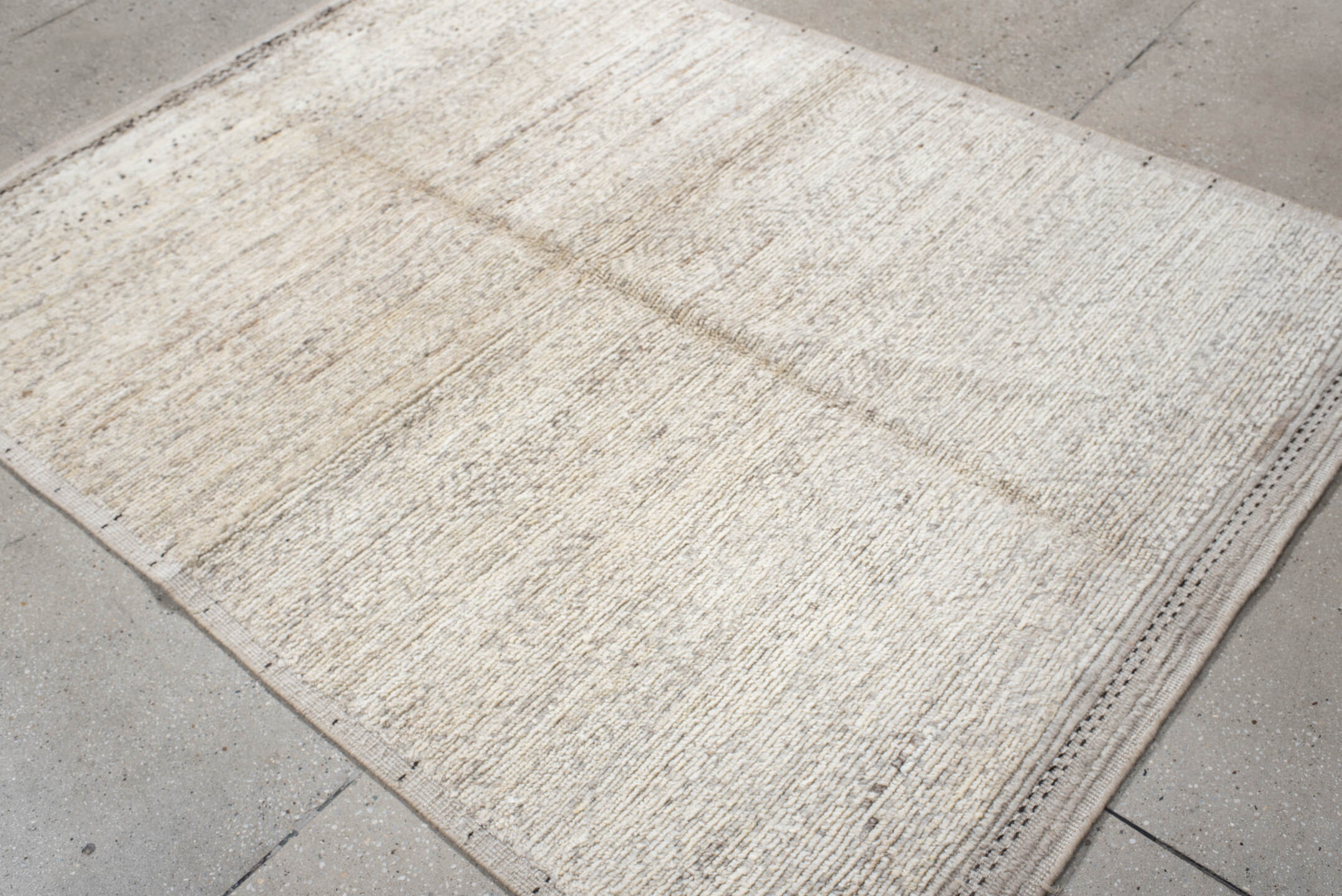5' x 7' one-of-a-kind handmade vintage Tulu rug. Color palette: ivory, cream, taupe, charcoal, beige, gray, black