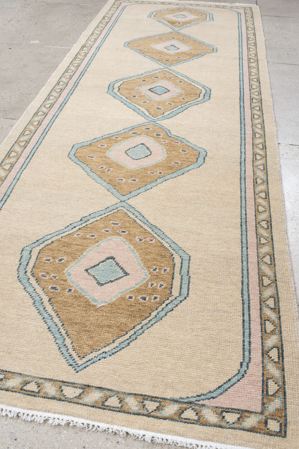 4' x 11' one-of-a-kind handmade vintage Oushak runner rug. Color palette: ivory, sand, pale blue, blush, taupe, beige