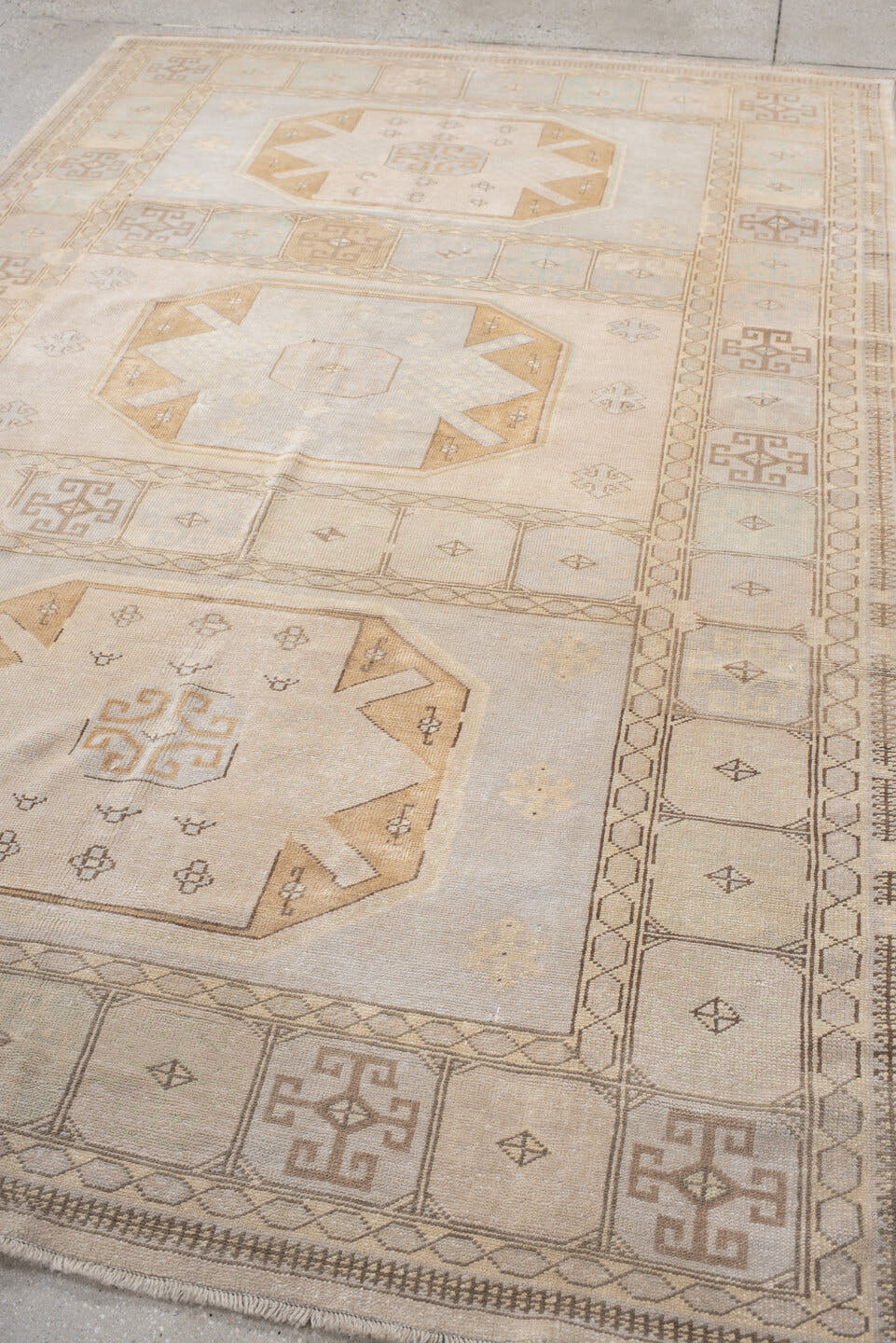 6' x 9' one-of-a-kind handmade vintage medium size rug. Color palette: ivory, pale blue, beige, camel, taupe, light blue
