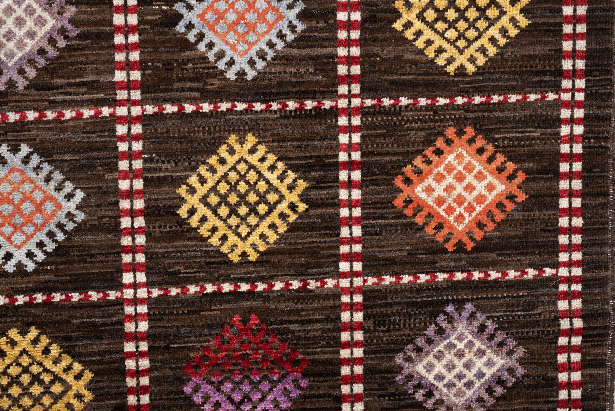 4' x 6' one-of-a-kind handmade vintage Jijim rug. Color palette: dark brown, ivory, coral, lavender, saffron, blue, sage