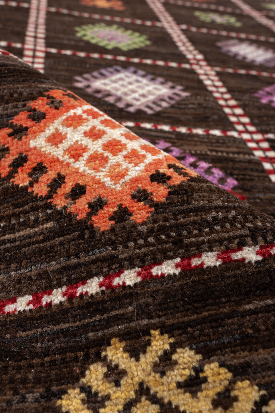 4' x 6' one-of-a-kind handmade vintage Jijim rug. Color palette: dark brown, ivory, coral, lavender, saffron, blue, sage
