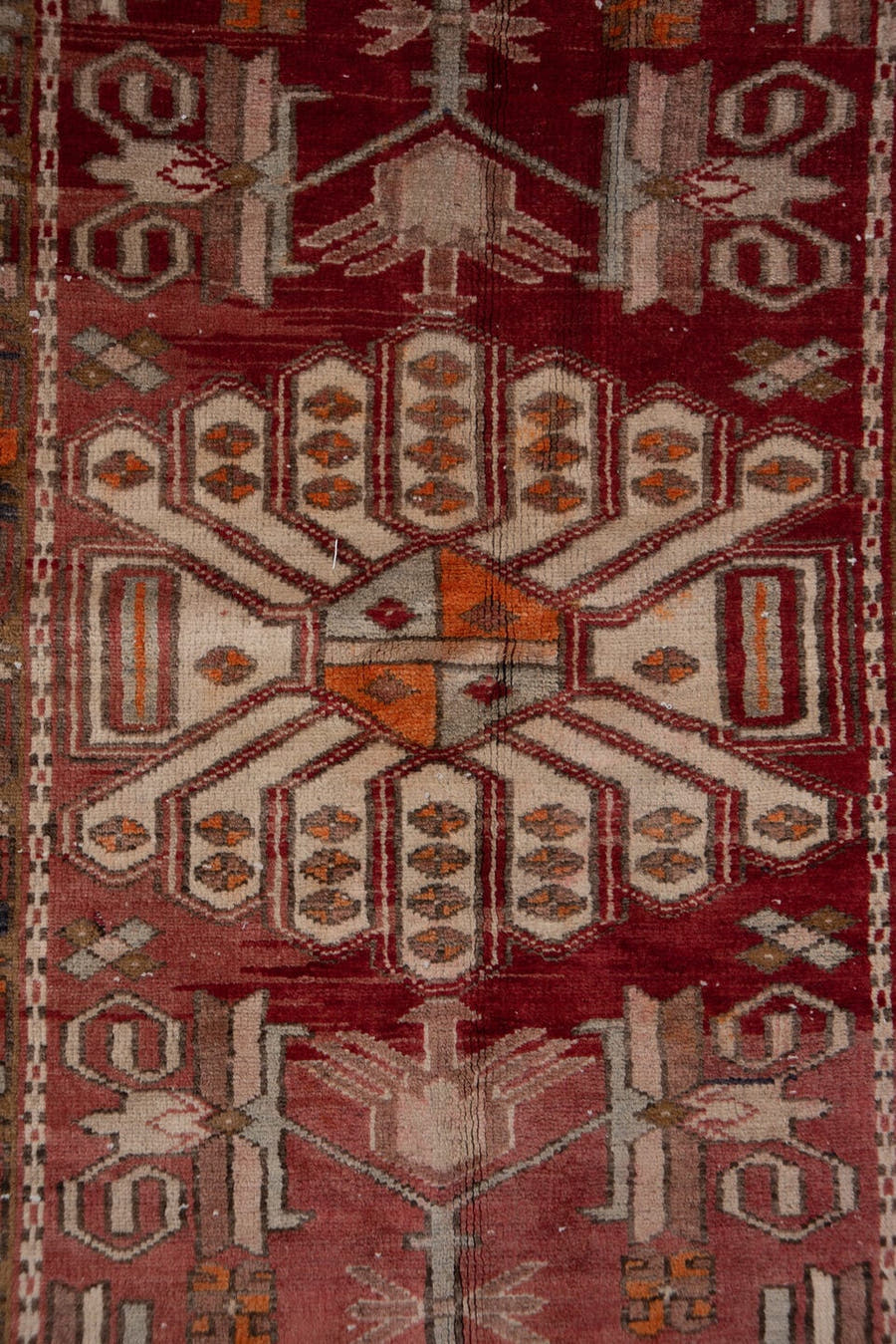 3' x 10' one-of-a-kind handmade vintage Heriz runner rug. Color palette: brick red, ivory, rose, rust, taupe, navy, orange