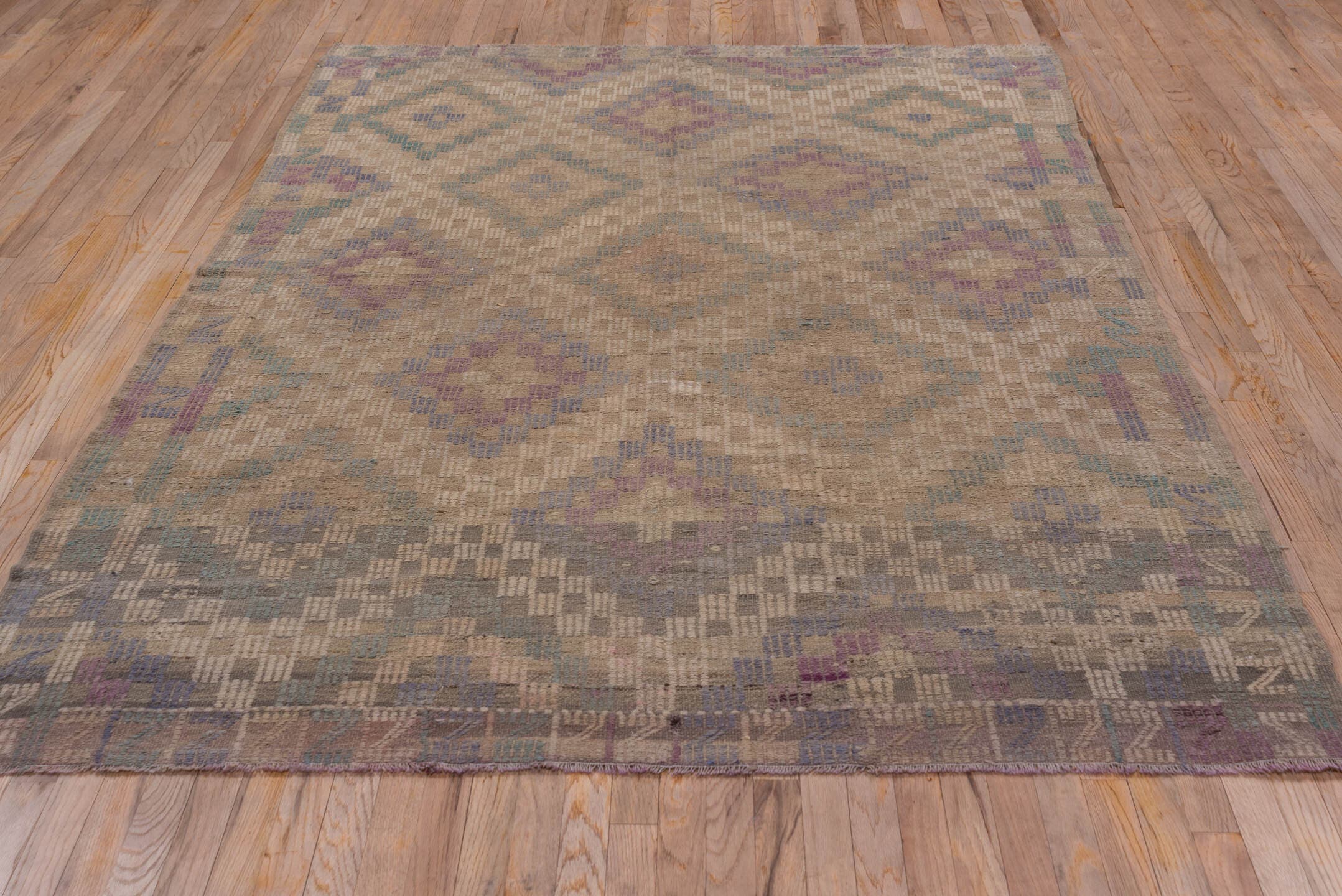 6' x 8' one-of-a-kind handmade vintage Jijim medium size rug. Color palette: taupe, beige, lavender, slate, teal, gray