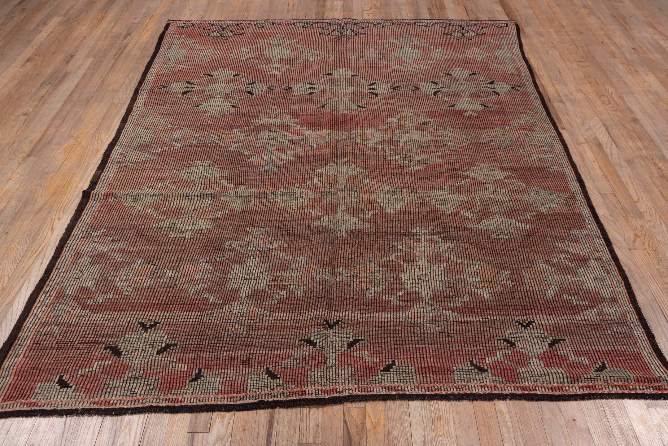 6' x 8' one-of-a-kind handmade vintage Jijim medium size rug. Color palette: black, brown, gray, pink, red, redwood