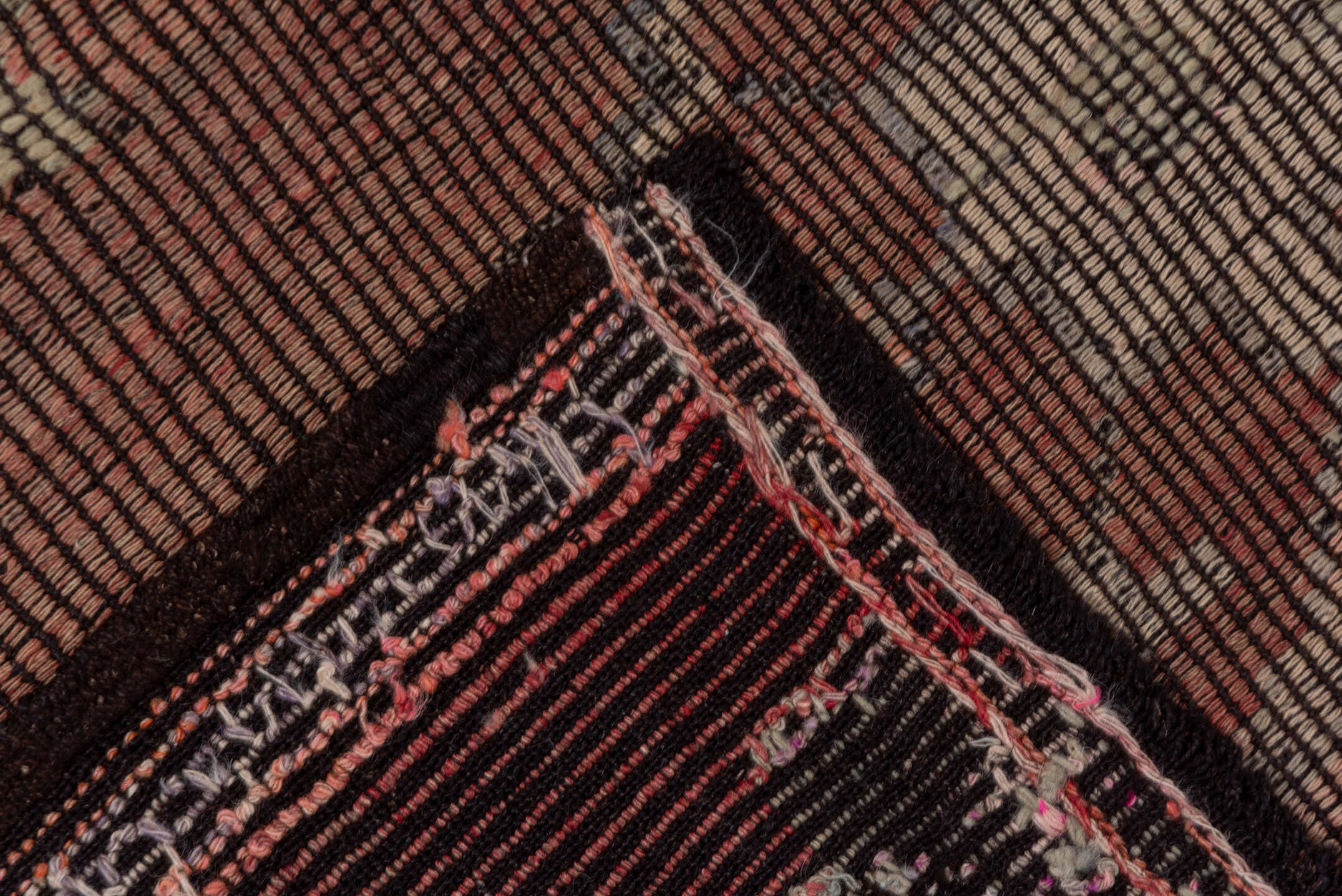 6' x 8' one-of-a-kind handmade vintage Jijim medium size rug. Color palette: black, brown, gray, pink, red, redwood