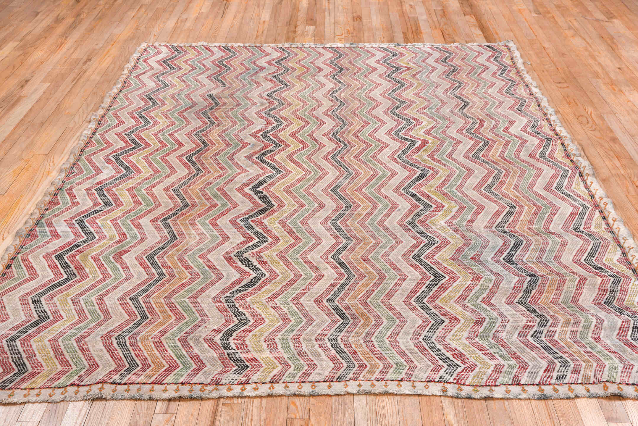 7' x 8' one-of-a-kind handmade vintage Jijim rug. Color palette: brown, ghost white, gray, light gray, off-white, pink, red