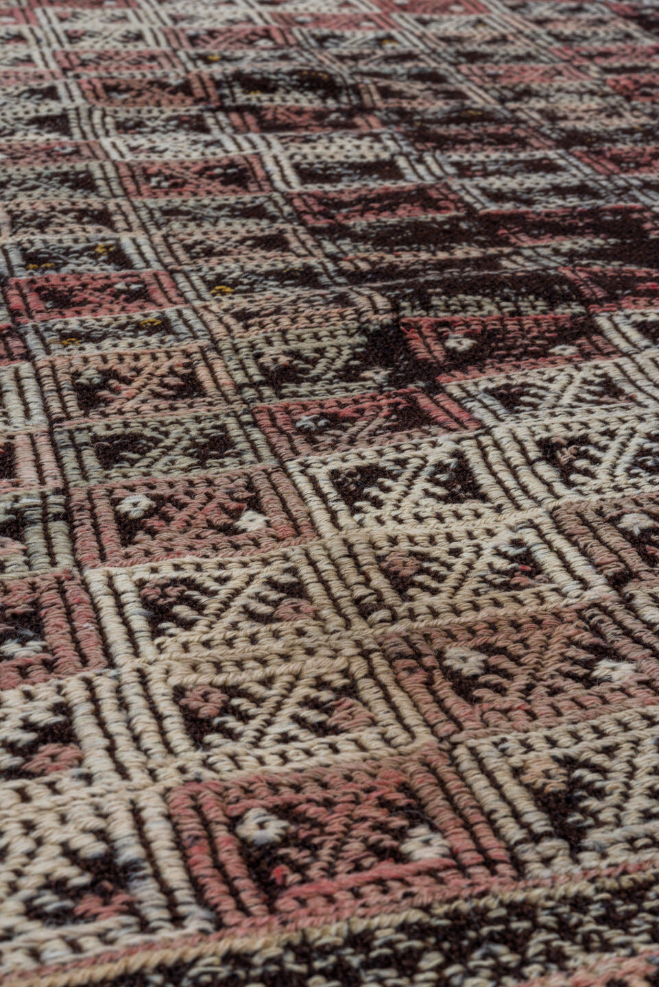 4' x 7' one-of-a-kind handmade vintage Jijim rug. Color palette: dark brown, ivory, rose, taupe, charcoal, brown, pink, red